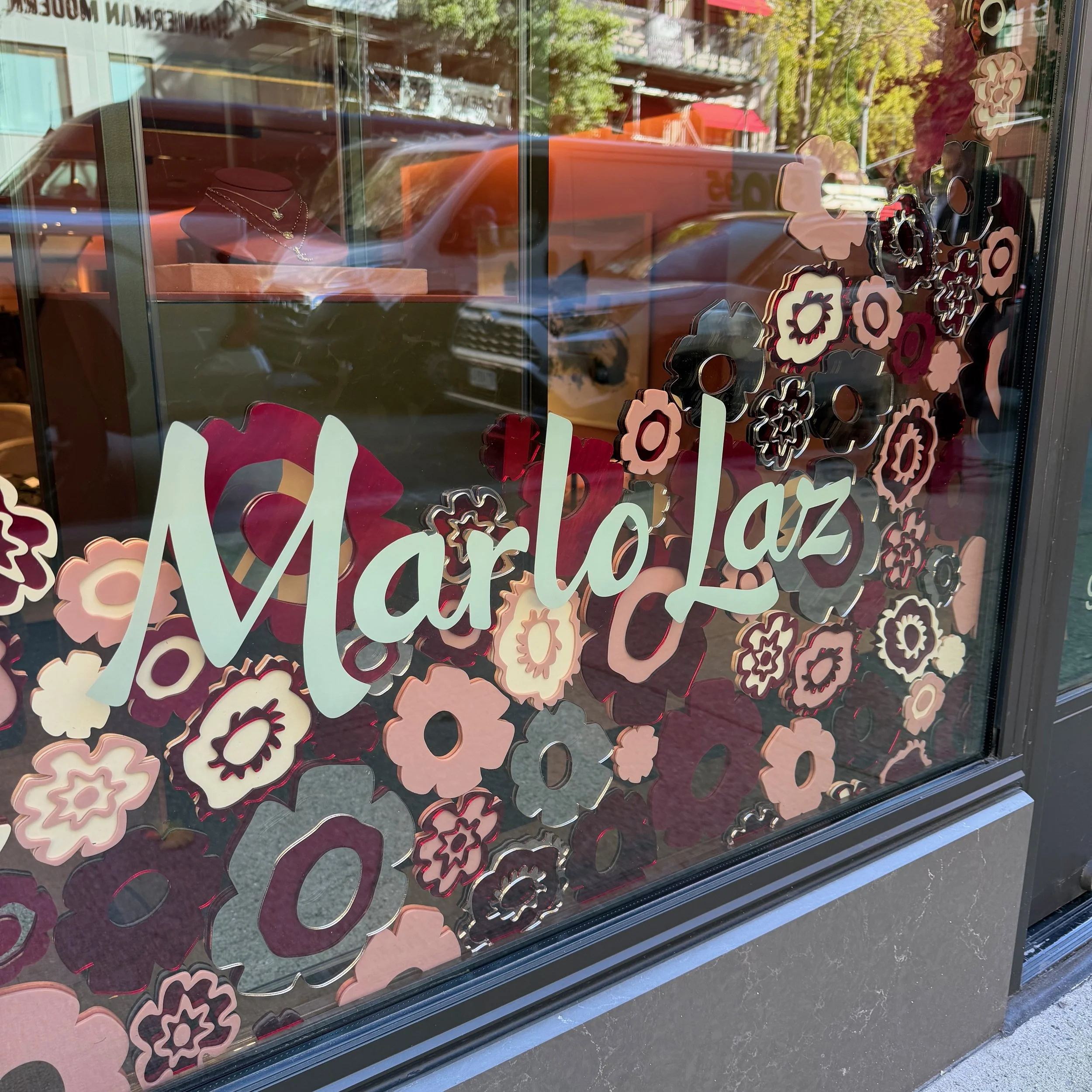 Marlo Laz logo on window decor Murano inspired 