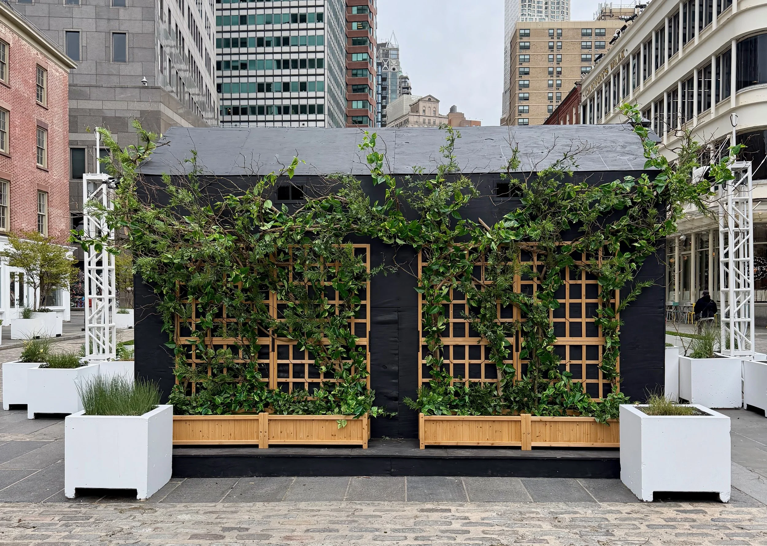 Greenery decor with real branches and faux greenery at Seaport in NYC for Sadie's
