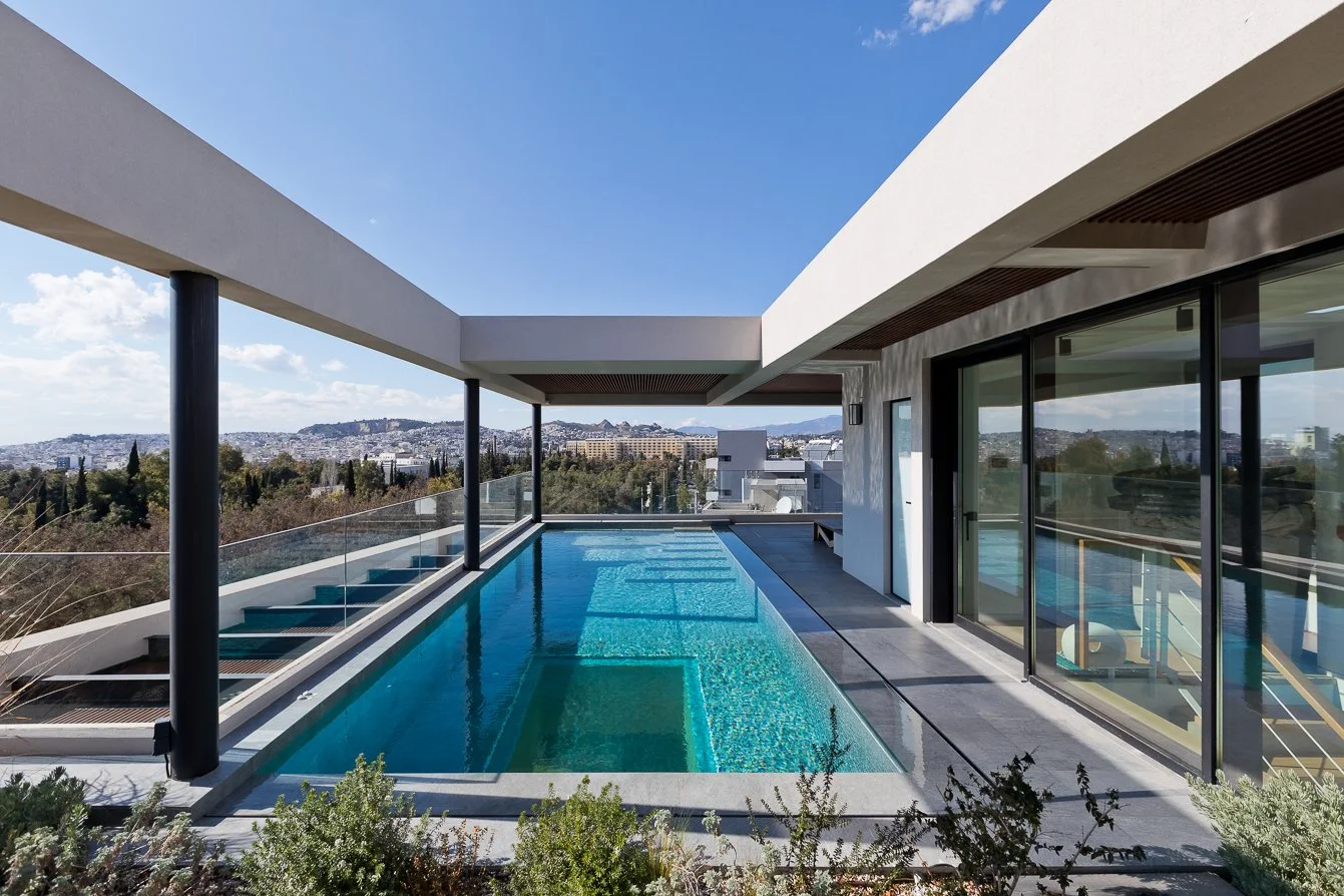 Rooftop swimming pool with glass bottom floor – dire architects