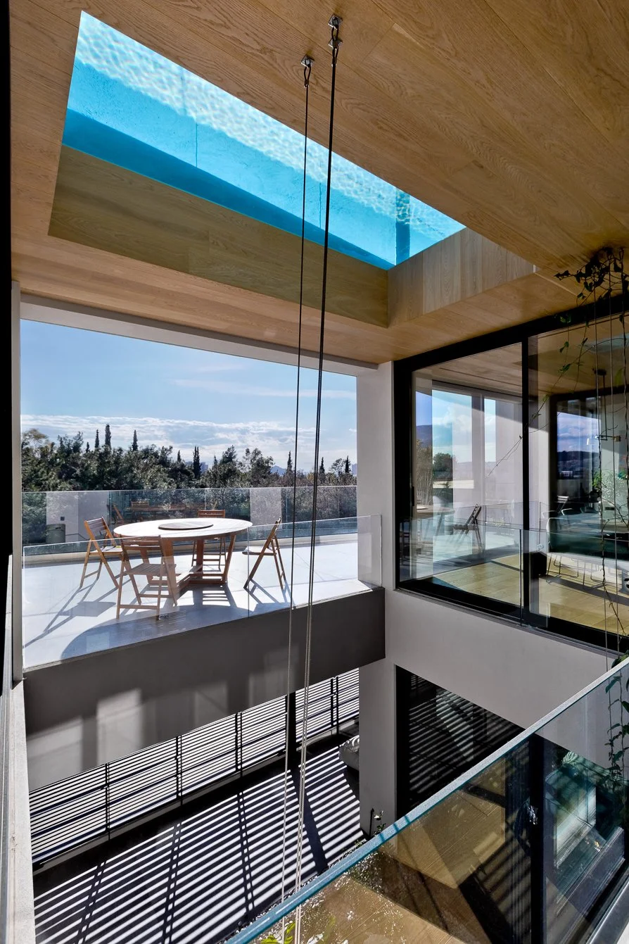 Glass bottom pool design casting light into interior garden – dire architects