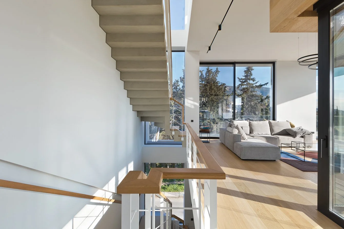 Modern exposed concrete custom design staircase in living spaces of luxury private residence in Papagou – dire architects