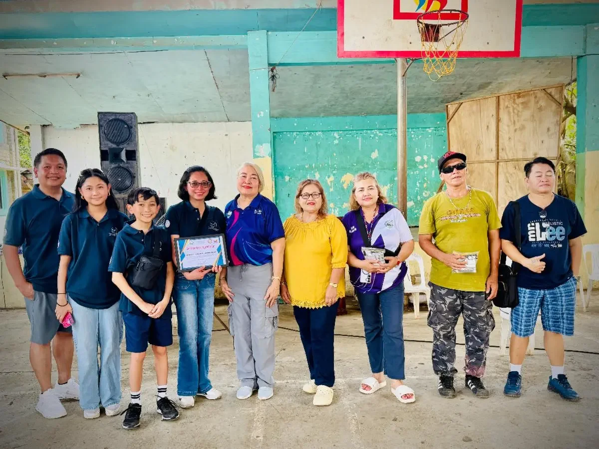 Dr. Buencamino-Francisco receiving a certificate of appreciation from local community officials at the Davao City medical mission