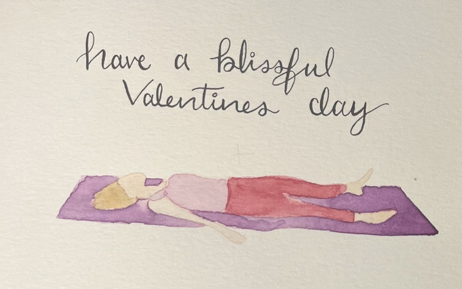 Person holding a cup of hot chocolate over a table decorated with candles, leaves, and a centerpiece, viewed from above.