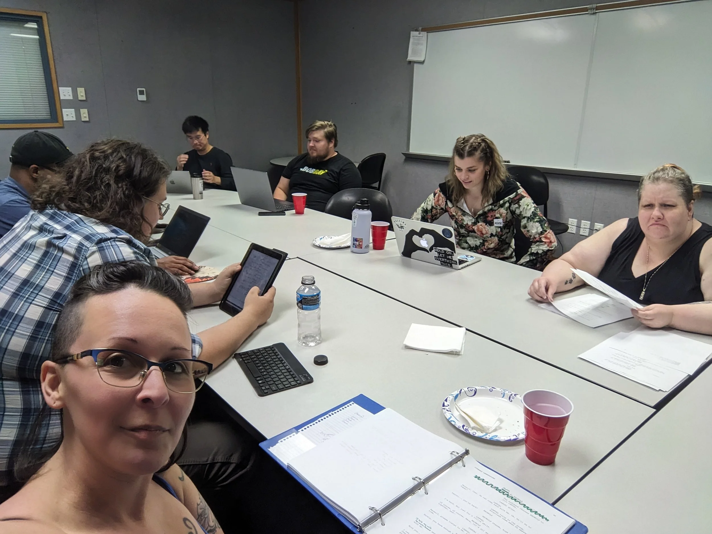 MFA students at a table read