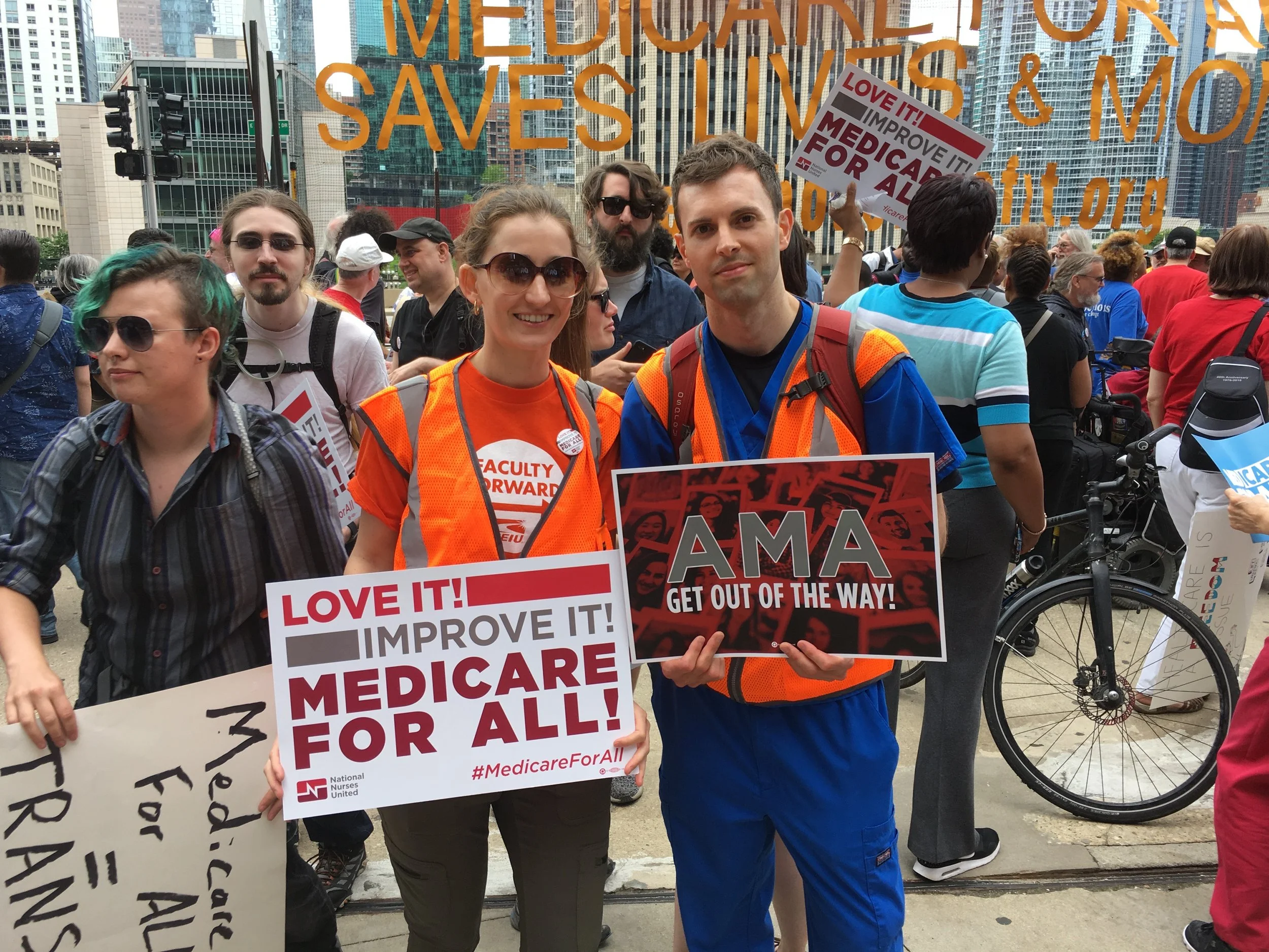 Photo of Jonathan Michels holding a sign that says "AMA Get Out of the Way!"