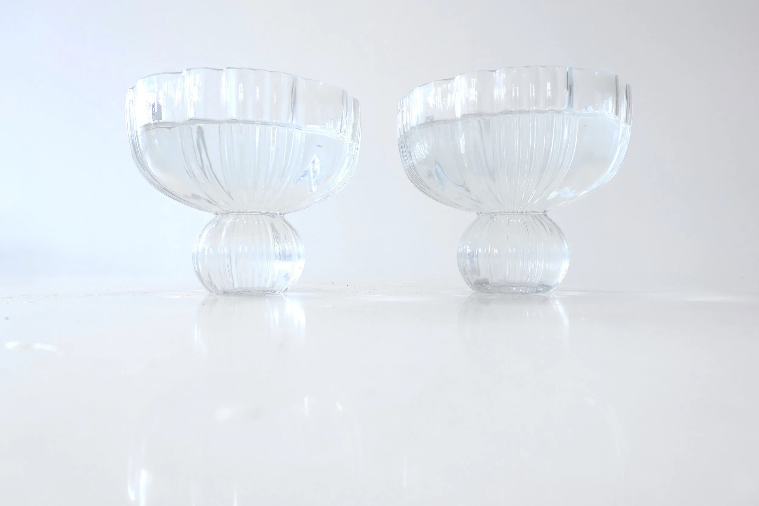 Clear, glass compote floral centerpiece Polly Flowers for nonprofits