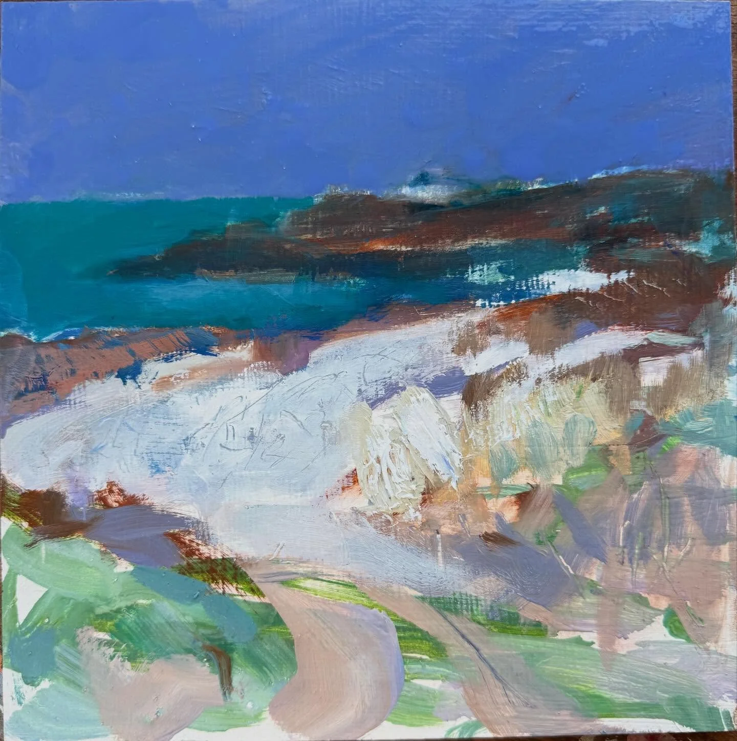 Pathway to La Fontenelle Bay. The bay is surrounded by boggy marshland, reeds and constantly shifting banks of grey pebbles that migrate with the strong tides in the area. In the distance, the derelict shore station that was once linked to Platte Fou