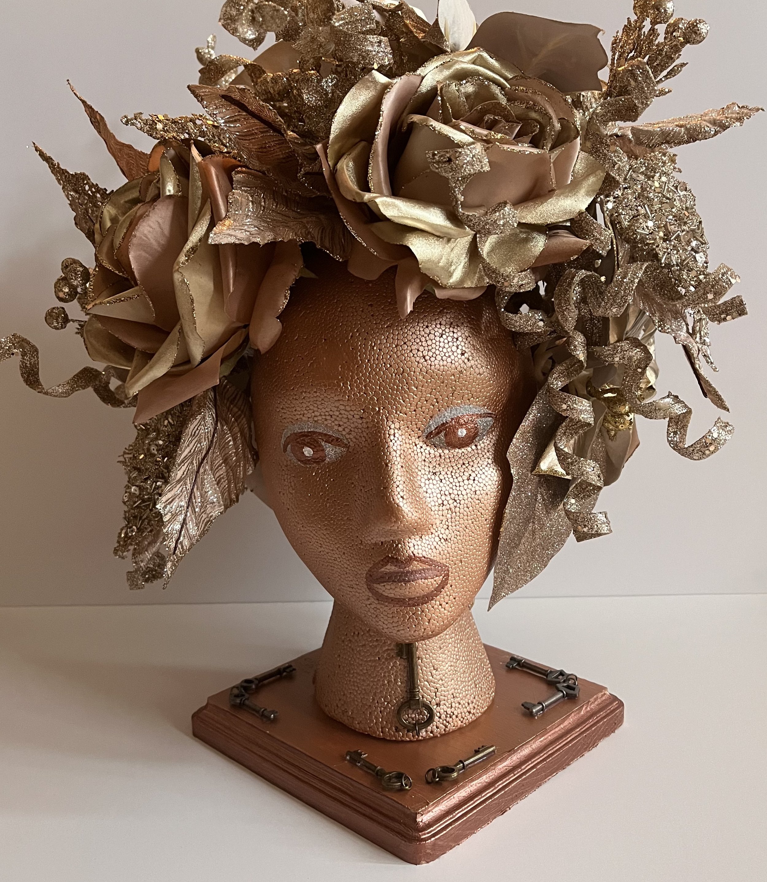 Self-Doubt: This sculpture is bronze because my self-esteem was improving, but I still doubted my abilities. Therefore, it is not a gold sculpture. The eyes are looking down to reflect self-doubt. When I was confident in my ability to use my voice, m
