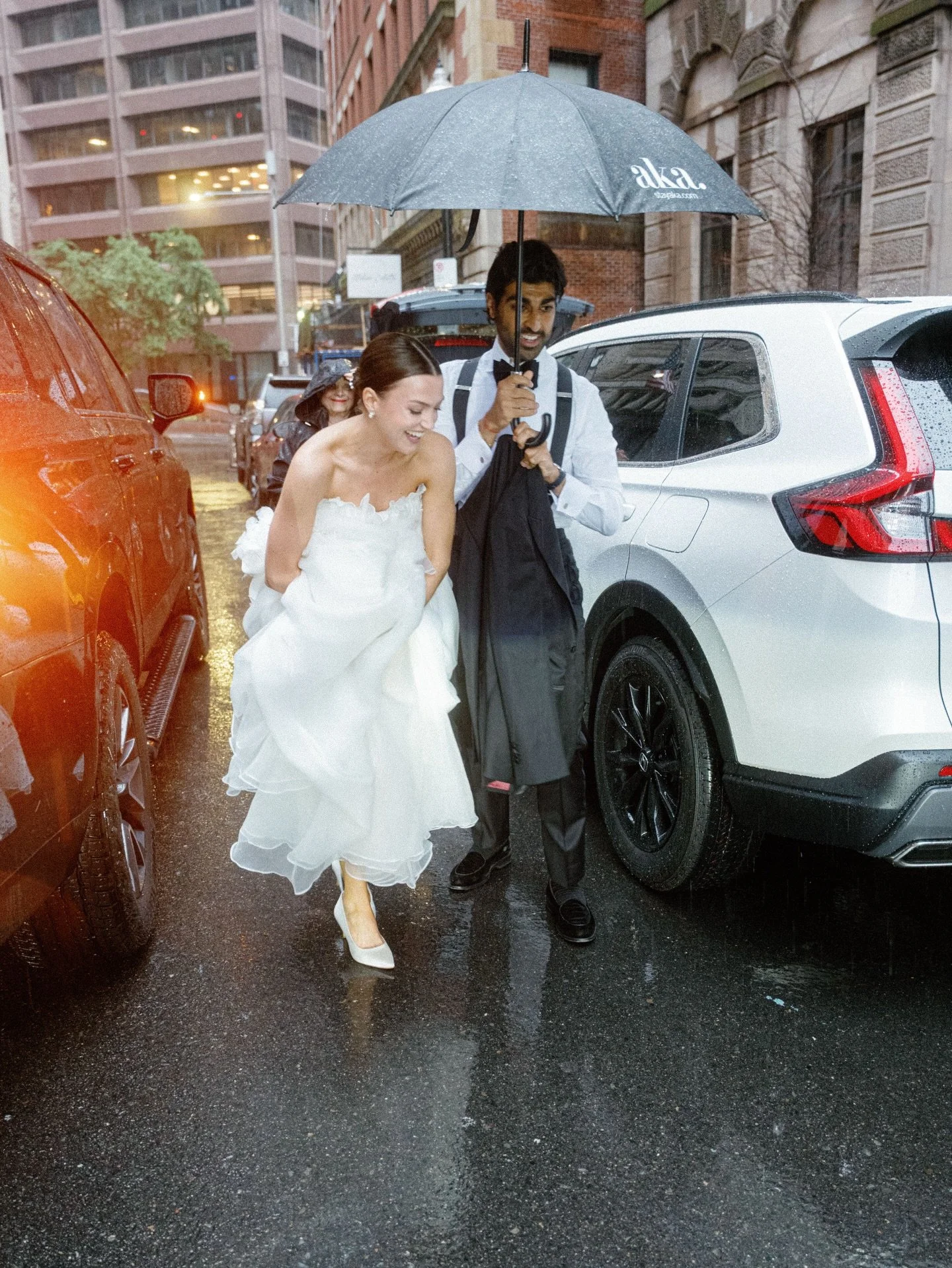 Rainy June nights in Boston just feel electric, the kind where the air is warm, the streets glow, and everything feels cinematic. Sara and Samir ran through the city under one umbrella, laughing as they dashed toward the doors of the @bostonathenaeum