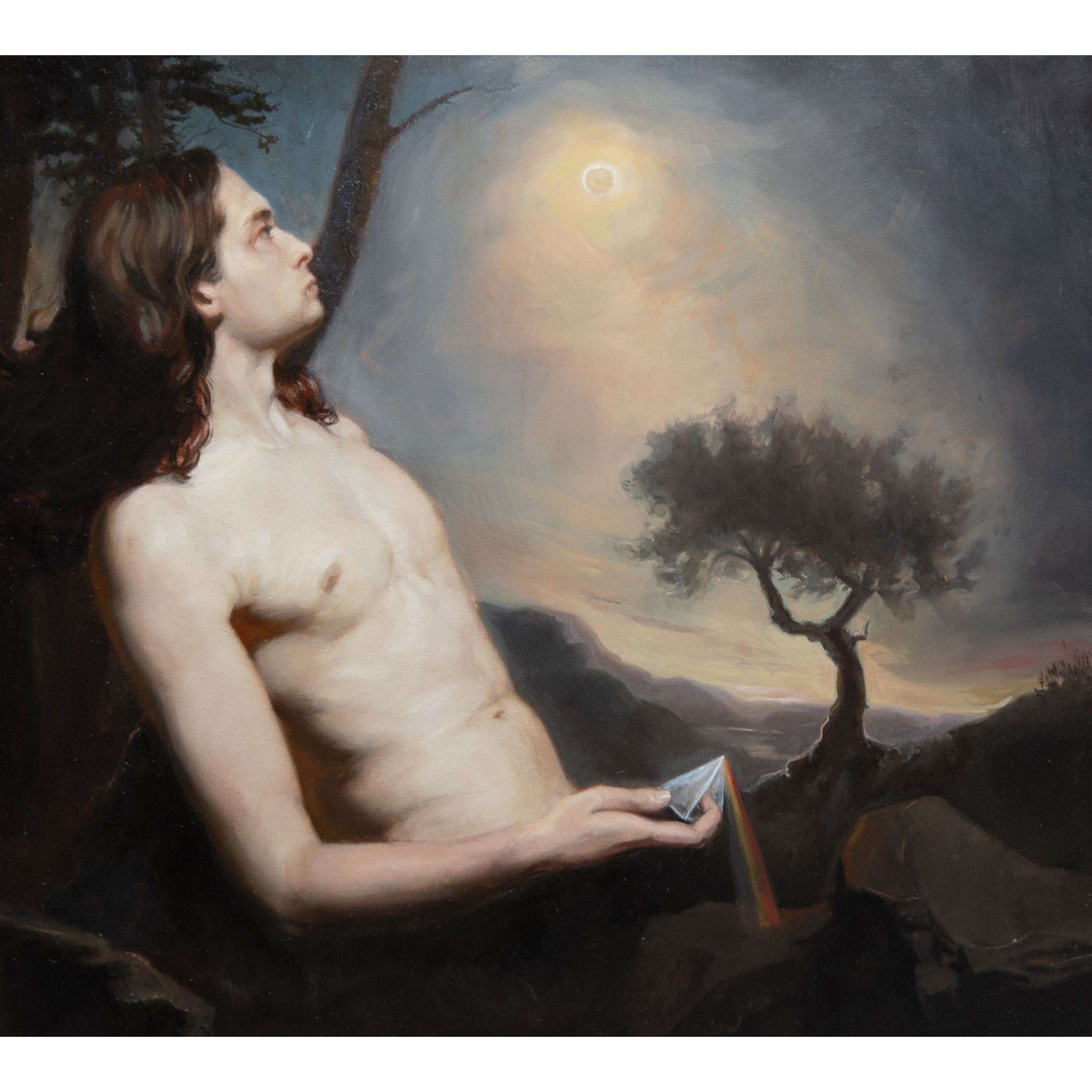A topless man with long brown hair sits outdoors at dusk, holding a prism that disperses light into a rainbow, with trees and a bright moon in the background.