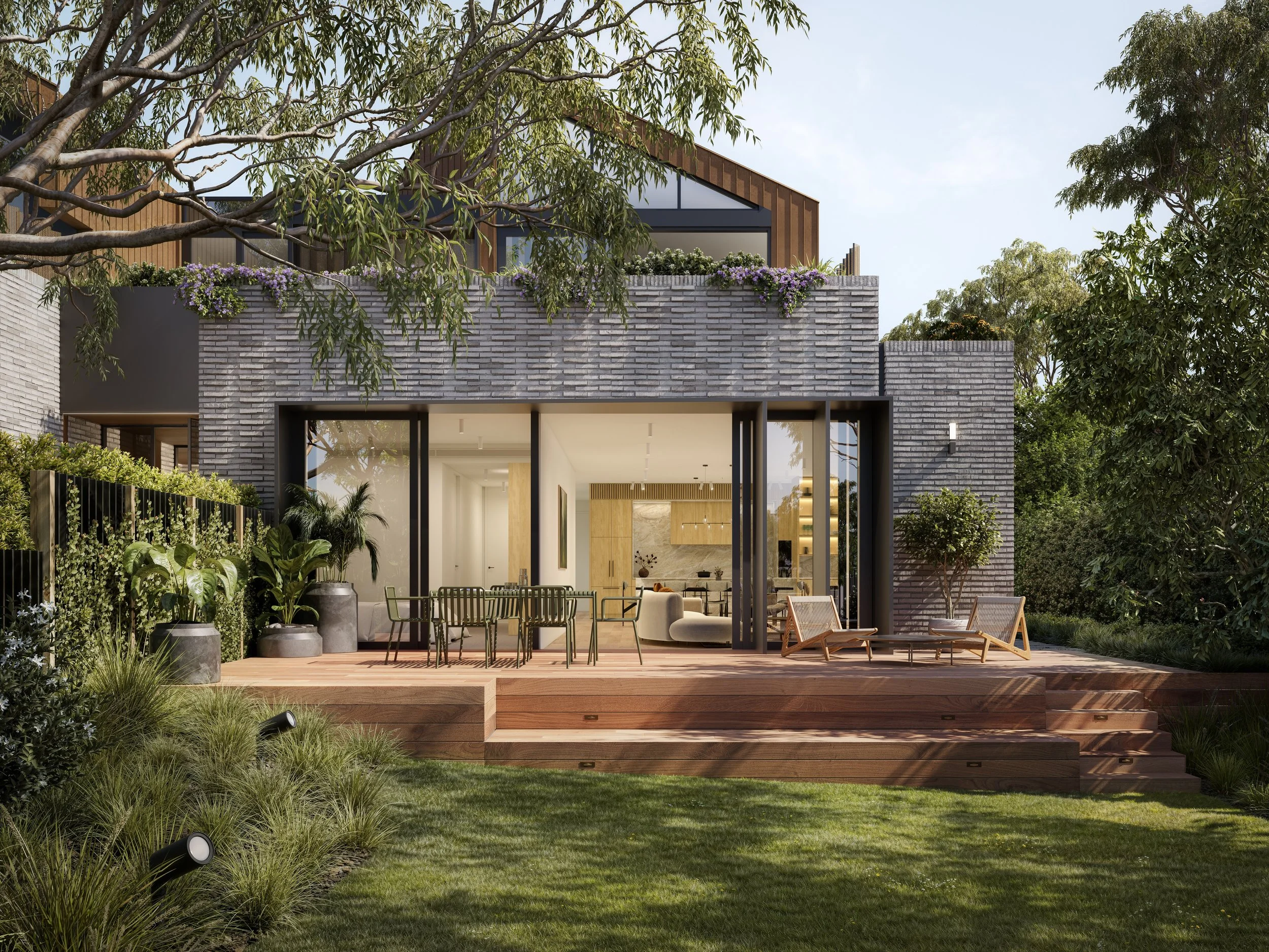 3D render of a modern house with a large glass sliding door opening onto a wooden deck furnished with outdoor chairs and plants, surrounded by lush greenery.