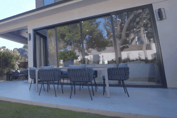 Modern home patio with large tinted windows reducing glare and heat for improved outdoor-indoor comfort