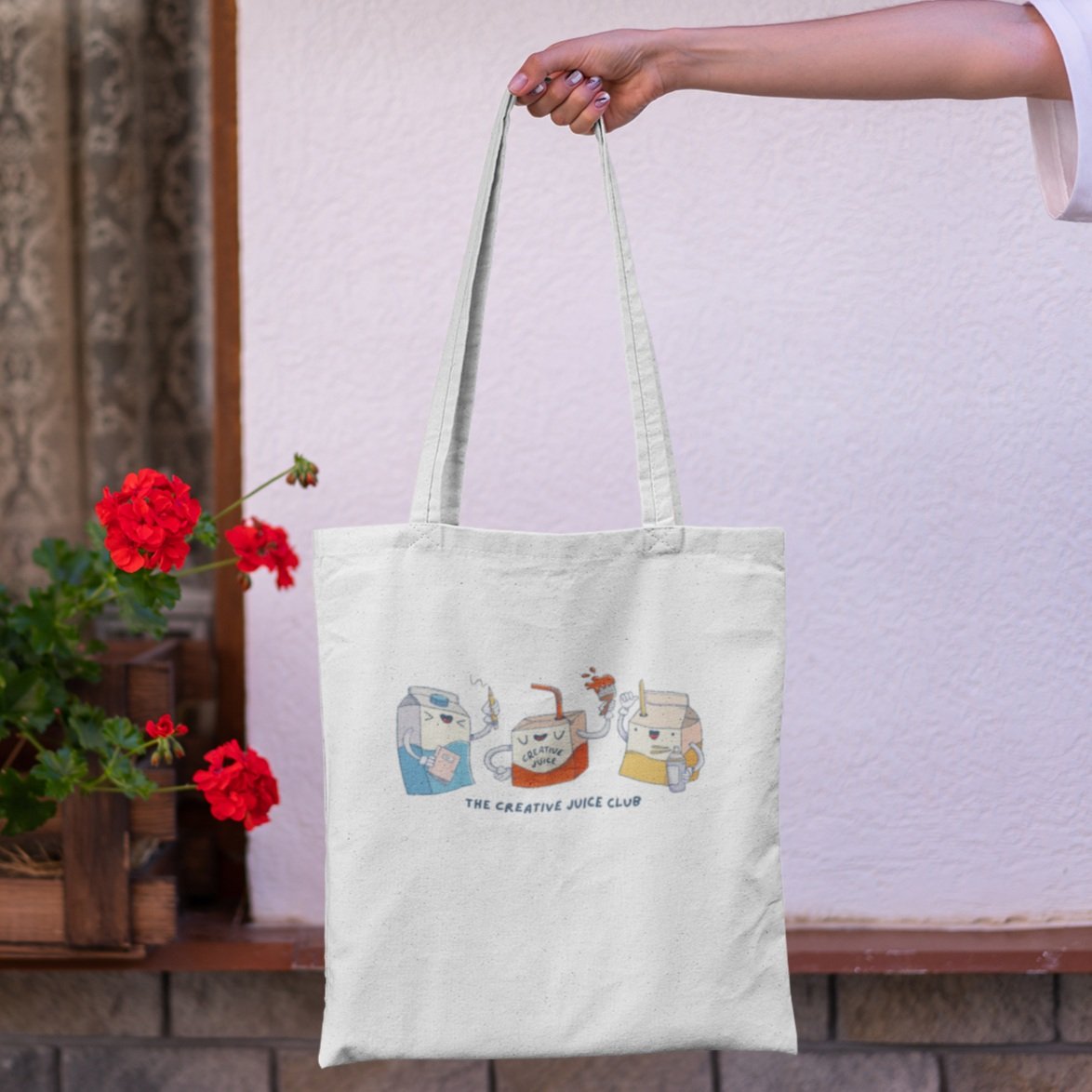 mockup-of-a-tote-bag-against-a-window-with-flowers-3136-el1.jpg