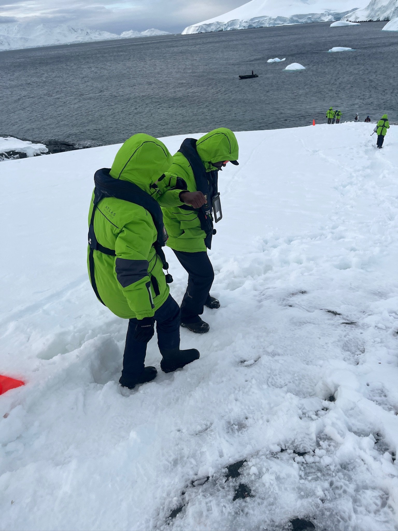 Abdoul helping our elderly shipmates navigate the snow