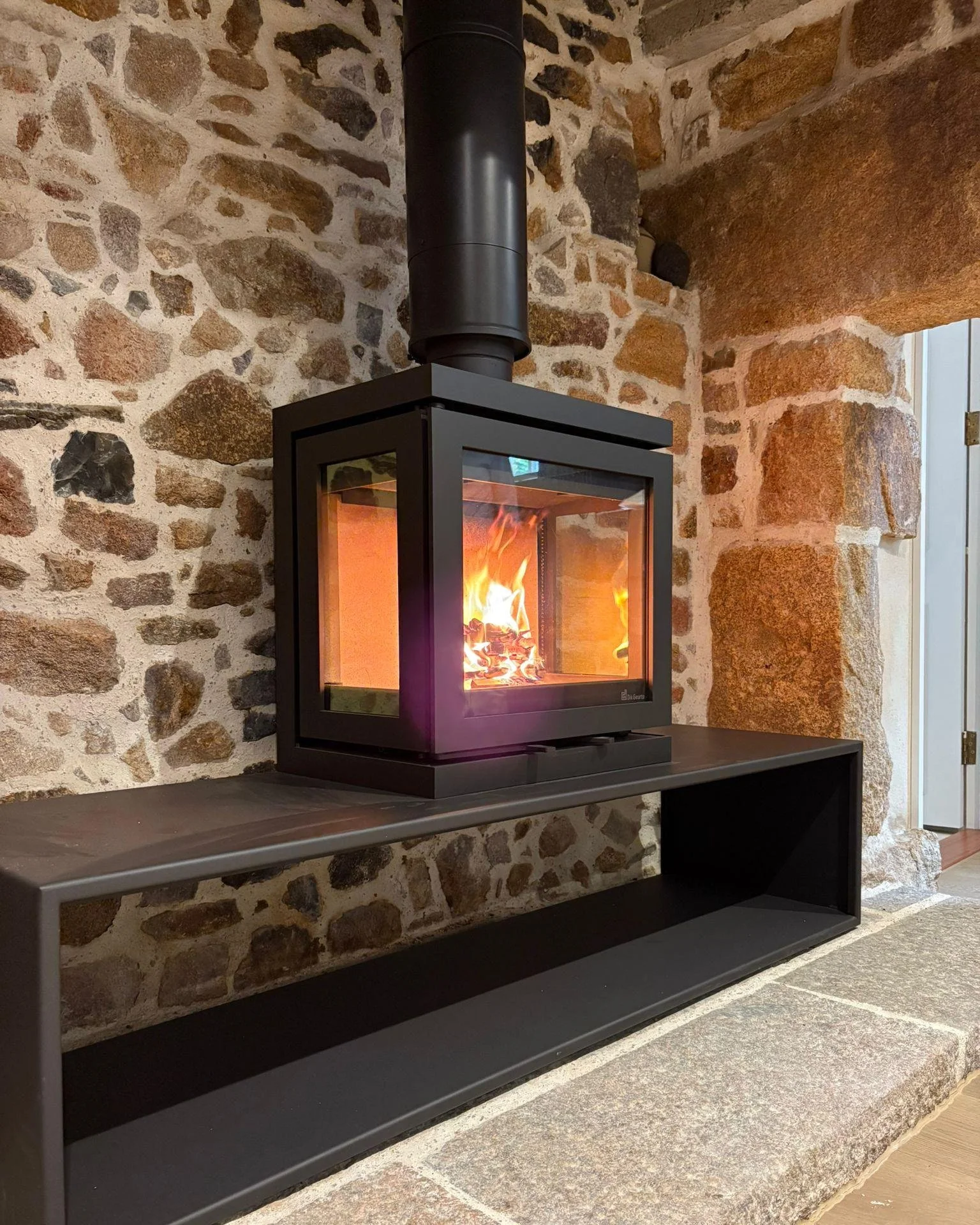 Need a small stove but have a large space to fill? No problem. 

This client needed just a 5kW stove to heat a small room, but had this beautiful big inglenook fireplace to do justice to. 

We worked together a find a solution which is the stunning @