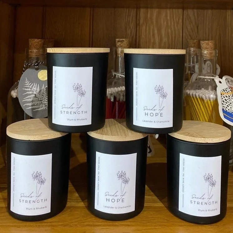 Looking for a gorgeous Christmas gift with meaning? You'll find these beautiful hand-poured candles produced by @jerseyskin in support of @tinyseedsjersey in our St. Mary Showroom. 

Available in a delicious choice of Plum &amp; Rhubarb or Lavender &