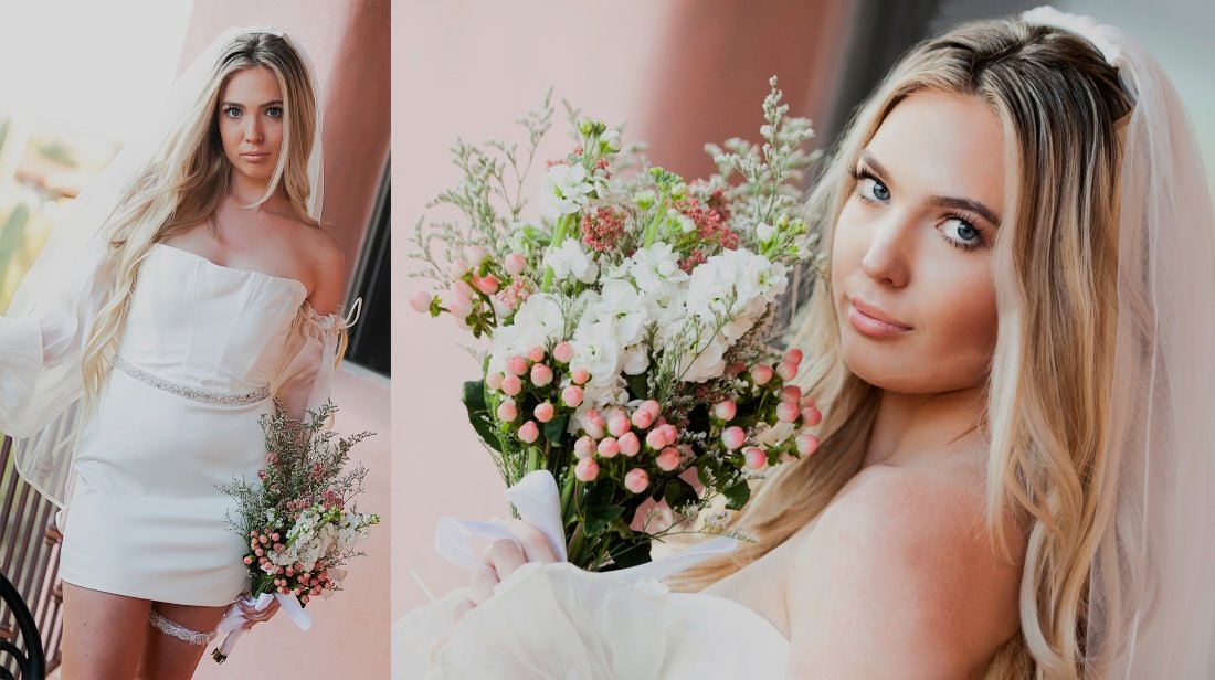 A bride with long blonde hair in a wedding dress holding a bouquet of flowers, posing for a photo.