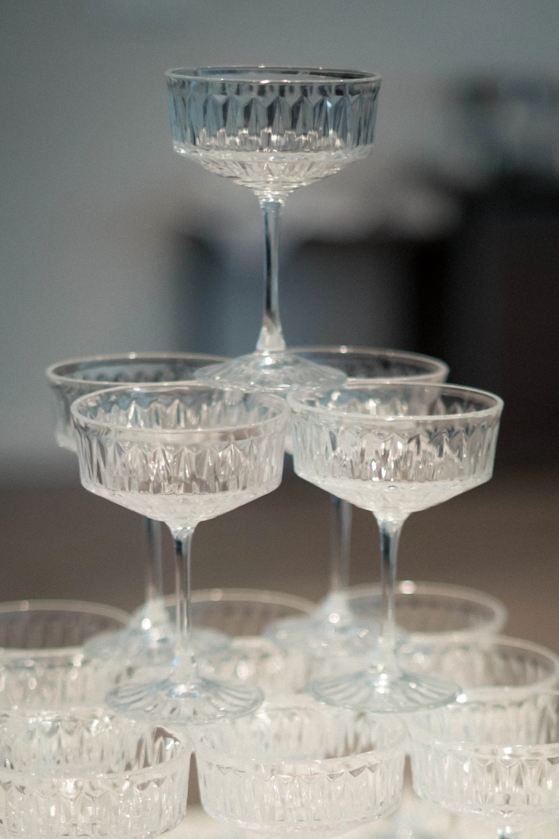 A champagne tower on a wedding day, before the champagne has been poured. 