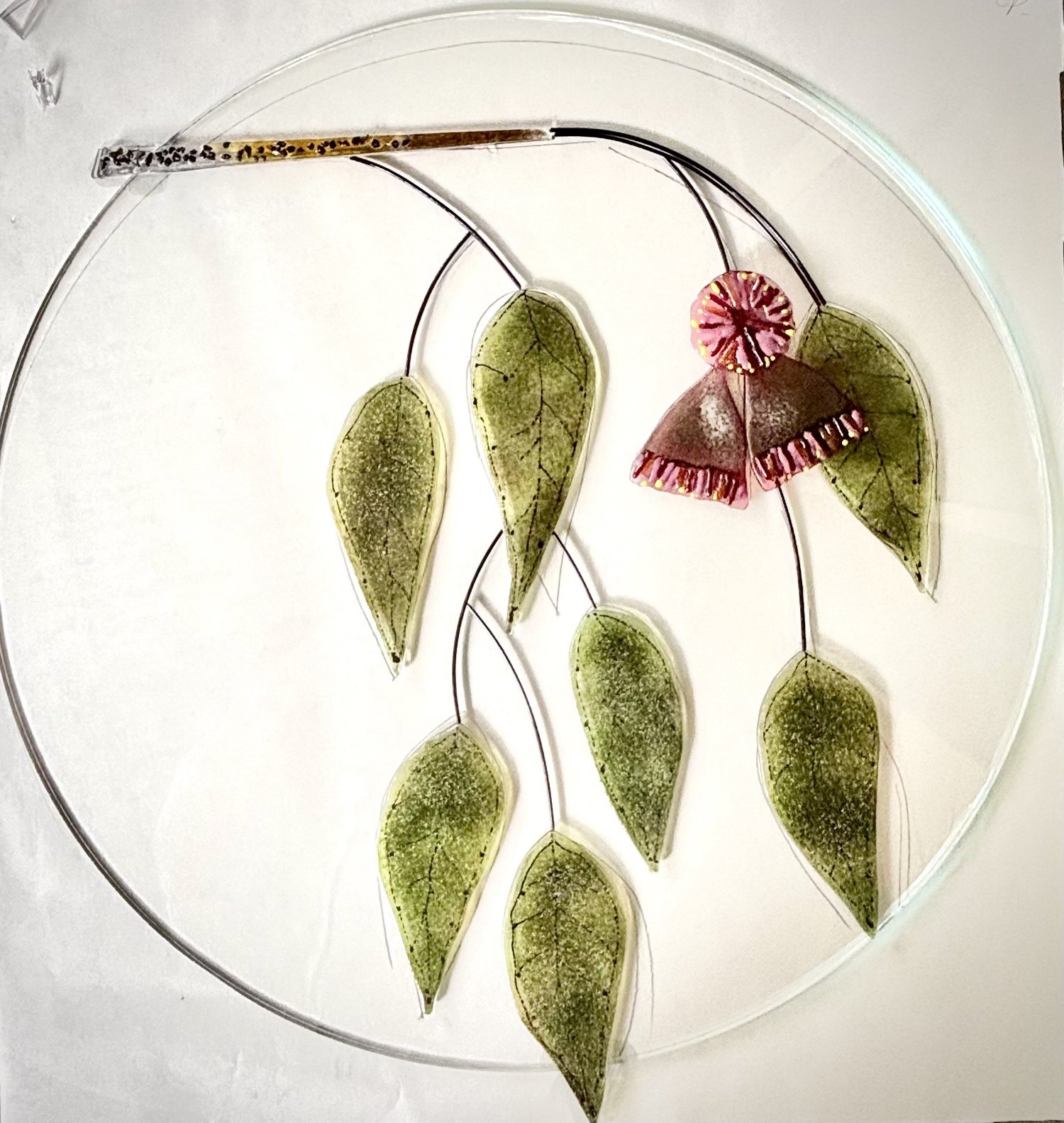 Lee’s clear glass botanical plate with eucalyptus leaves and pink gum blossoms