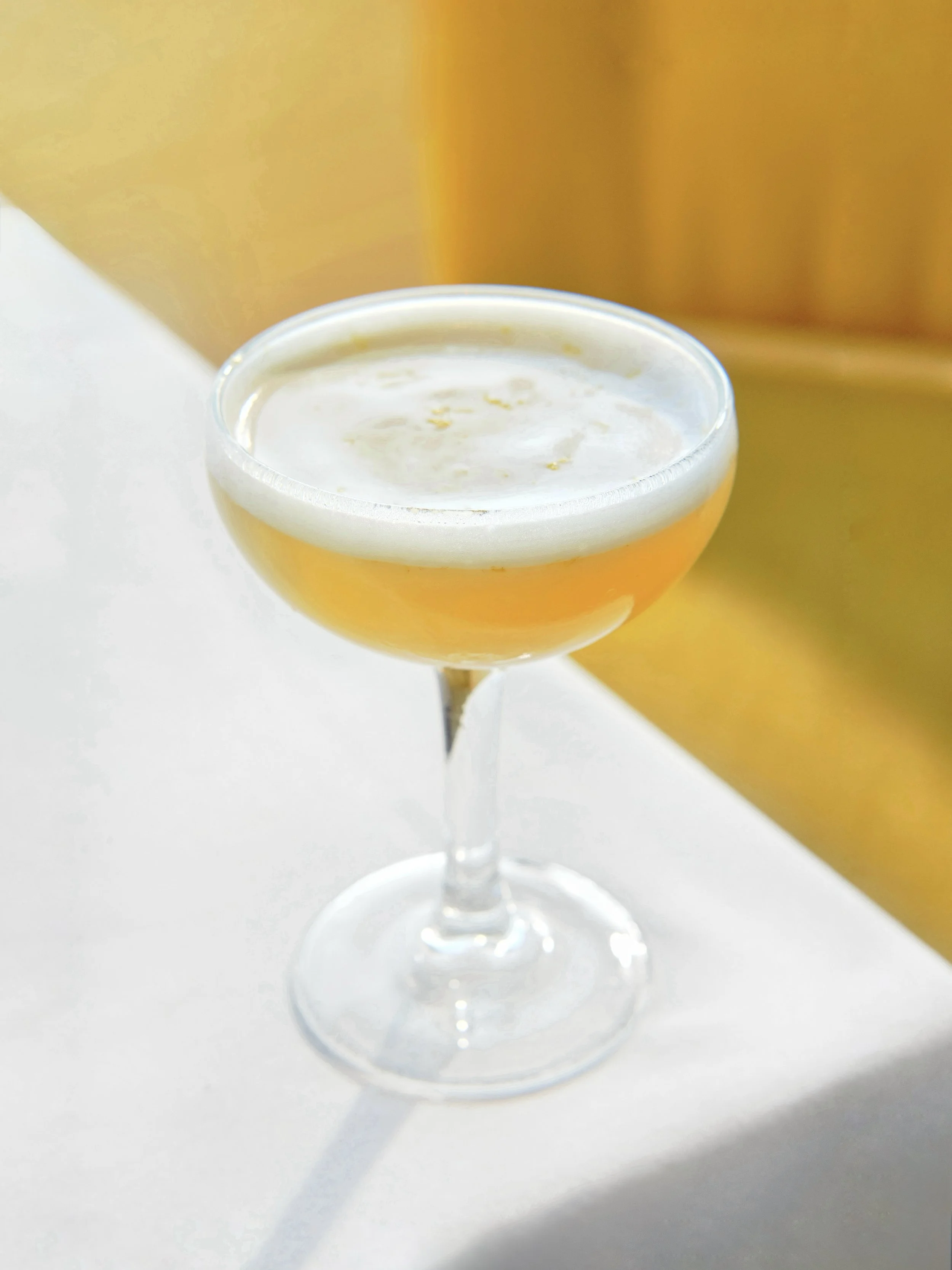 light cocktail with foamy top