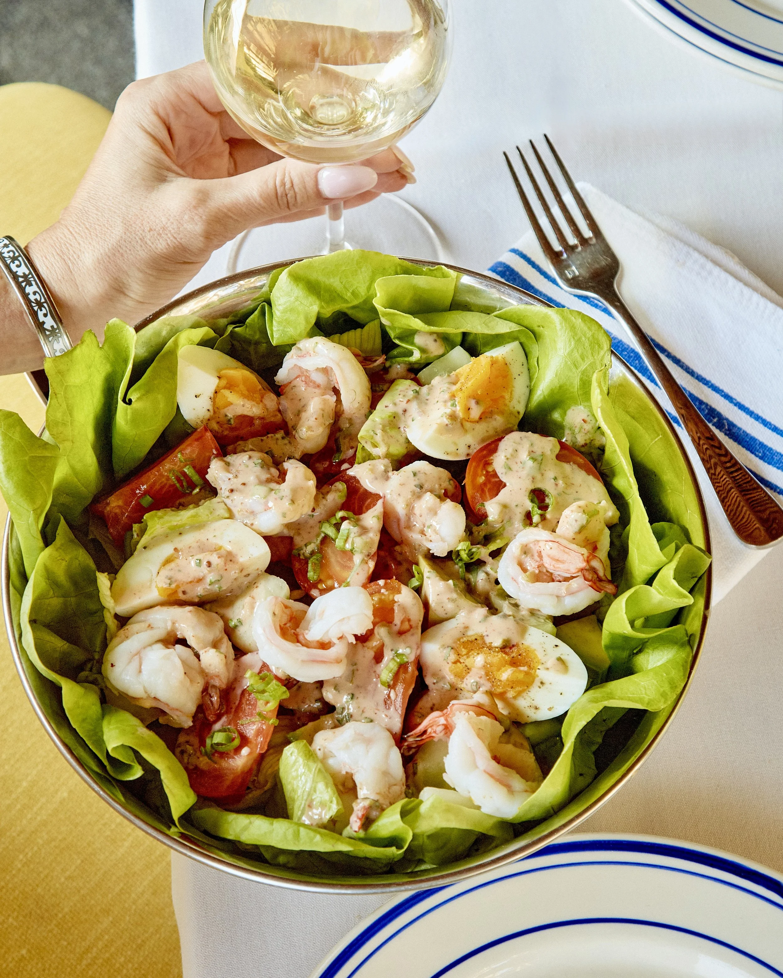 tableside shrimp louie and glass of Sancerre