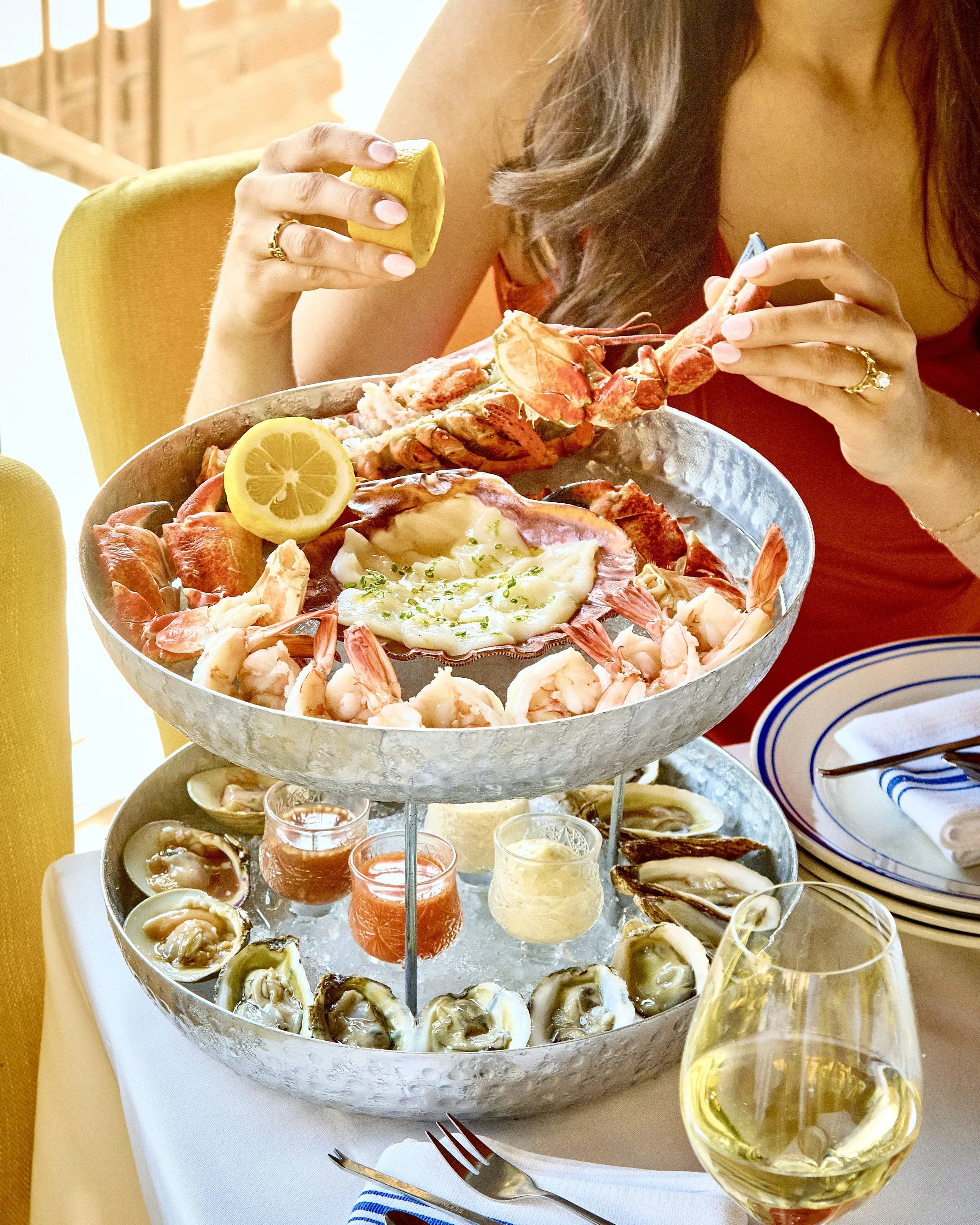woman enjoying the seafood tower