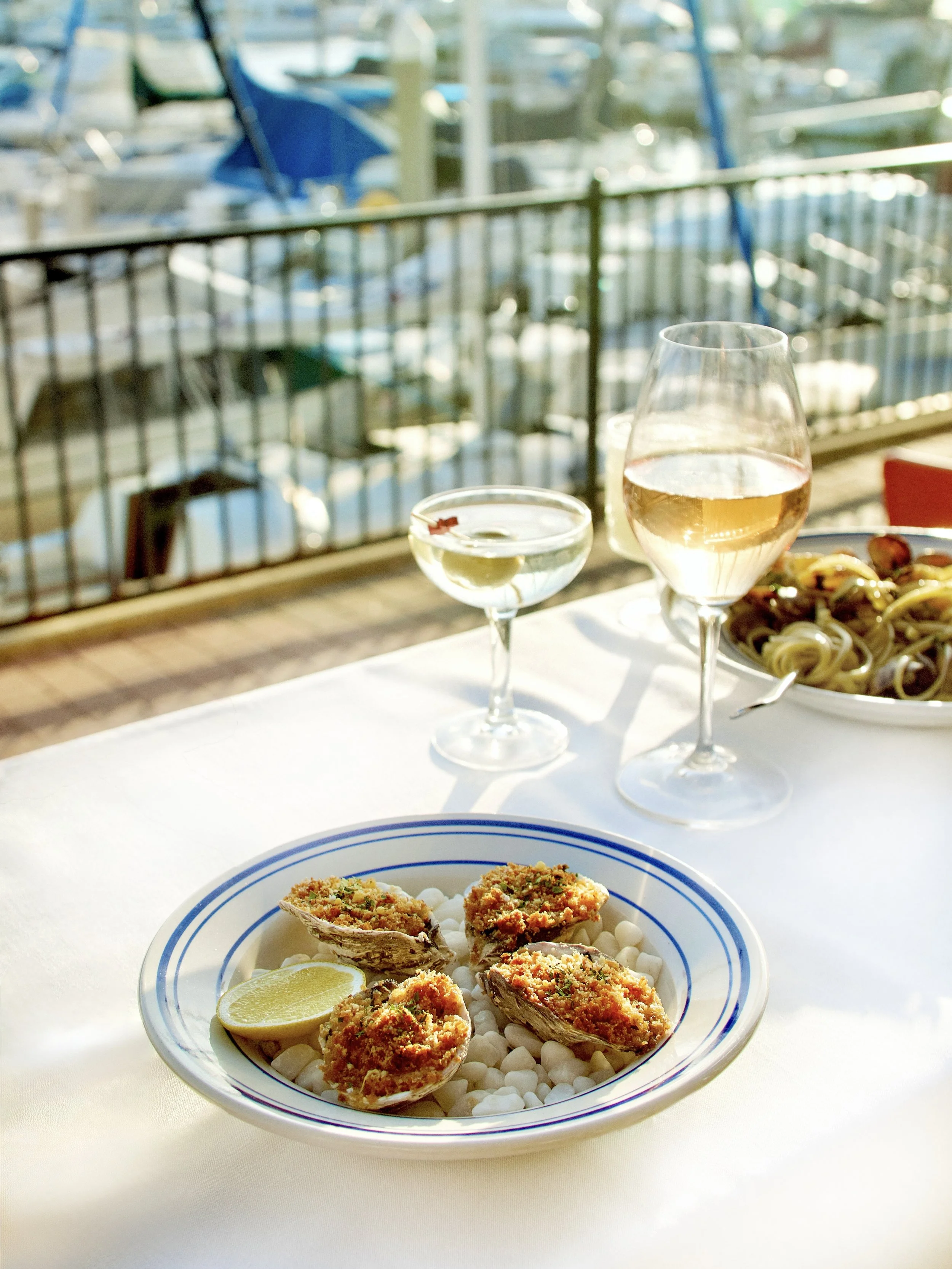 meal overlooking the marina on the outdoor patio