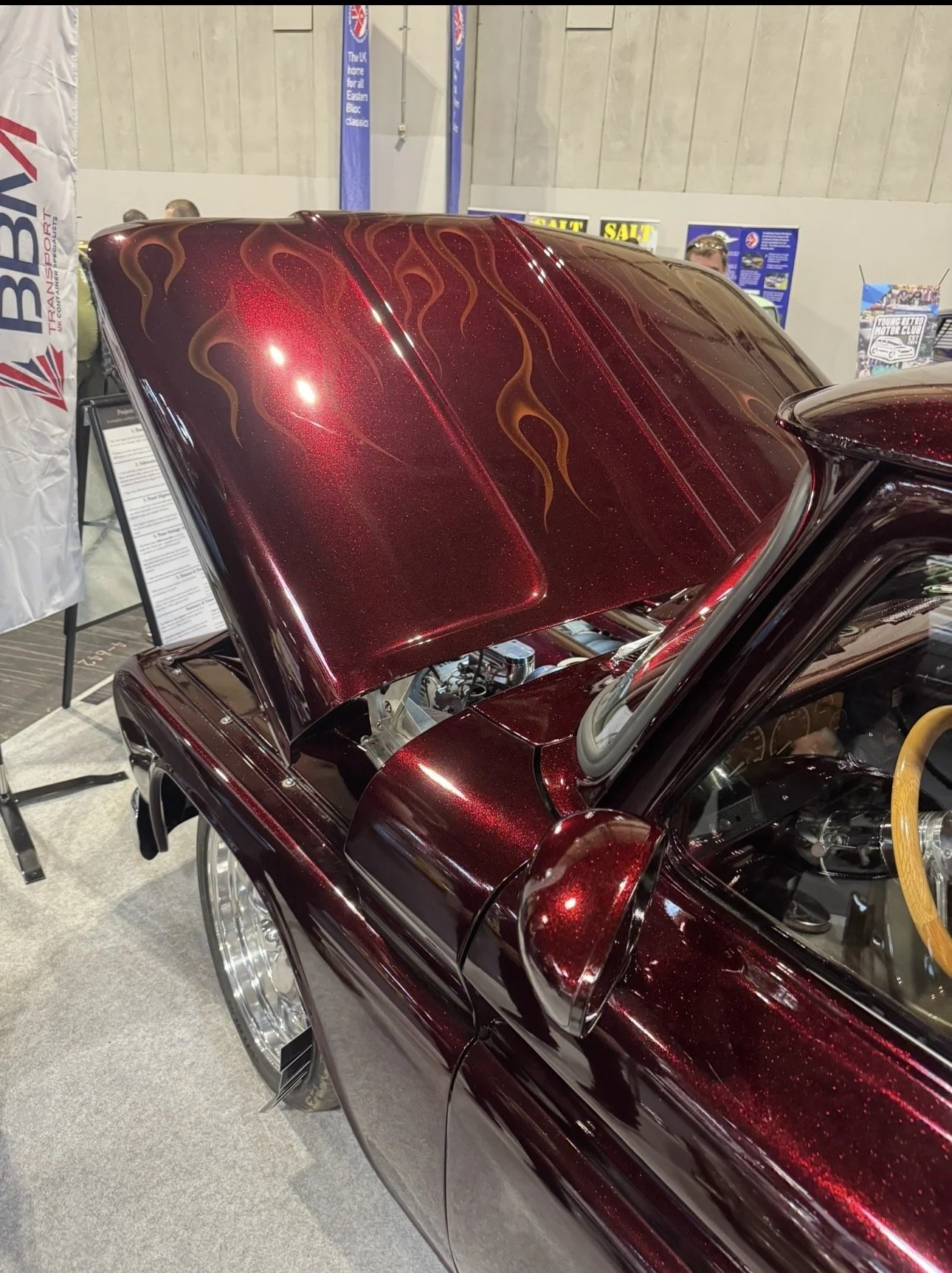 Finished Chevrolet C10 restomod in candy red paint and ghost flames at concours classics Suffolk