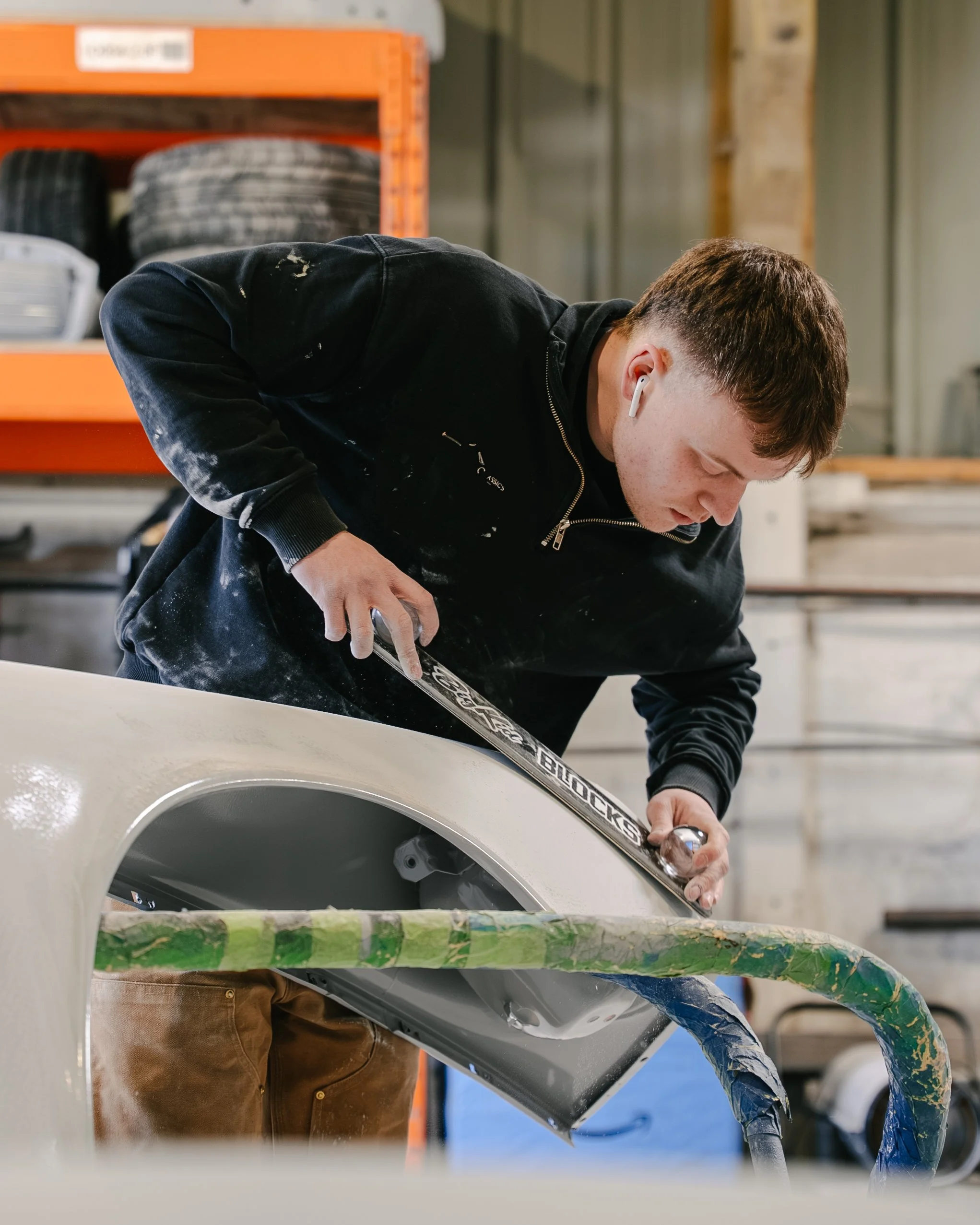 Porsche 911 Panels in Epoxy primer before guards red respray at concours classics