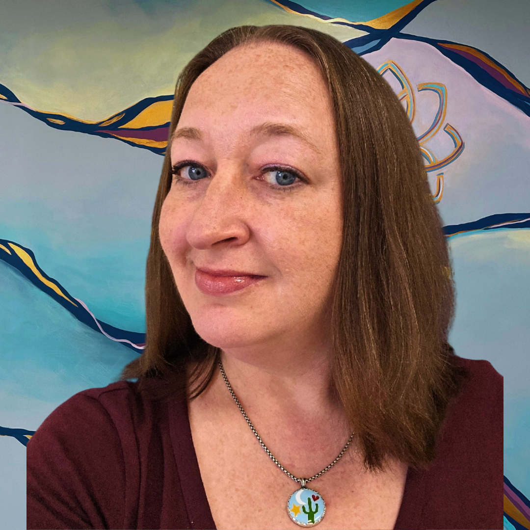 A woman with long brown hair wearing a black top and a black choker necklace, smiling in front of a colorful abstract mural.