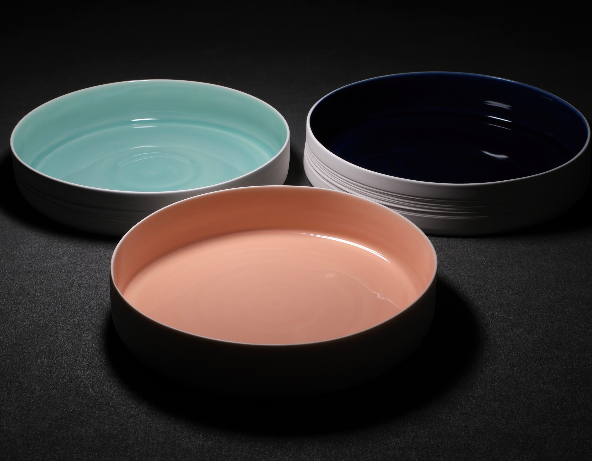 GATHERING - this series of porcelain vessels moves from the individual resilience and stillness of HOLD STILL to the realm of collective support. These vessels provide sanctuary, performing the act of "holding" for others.