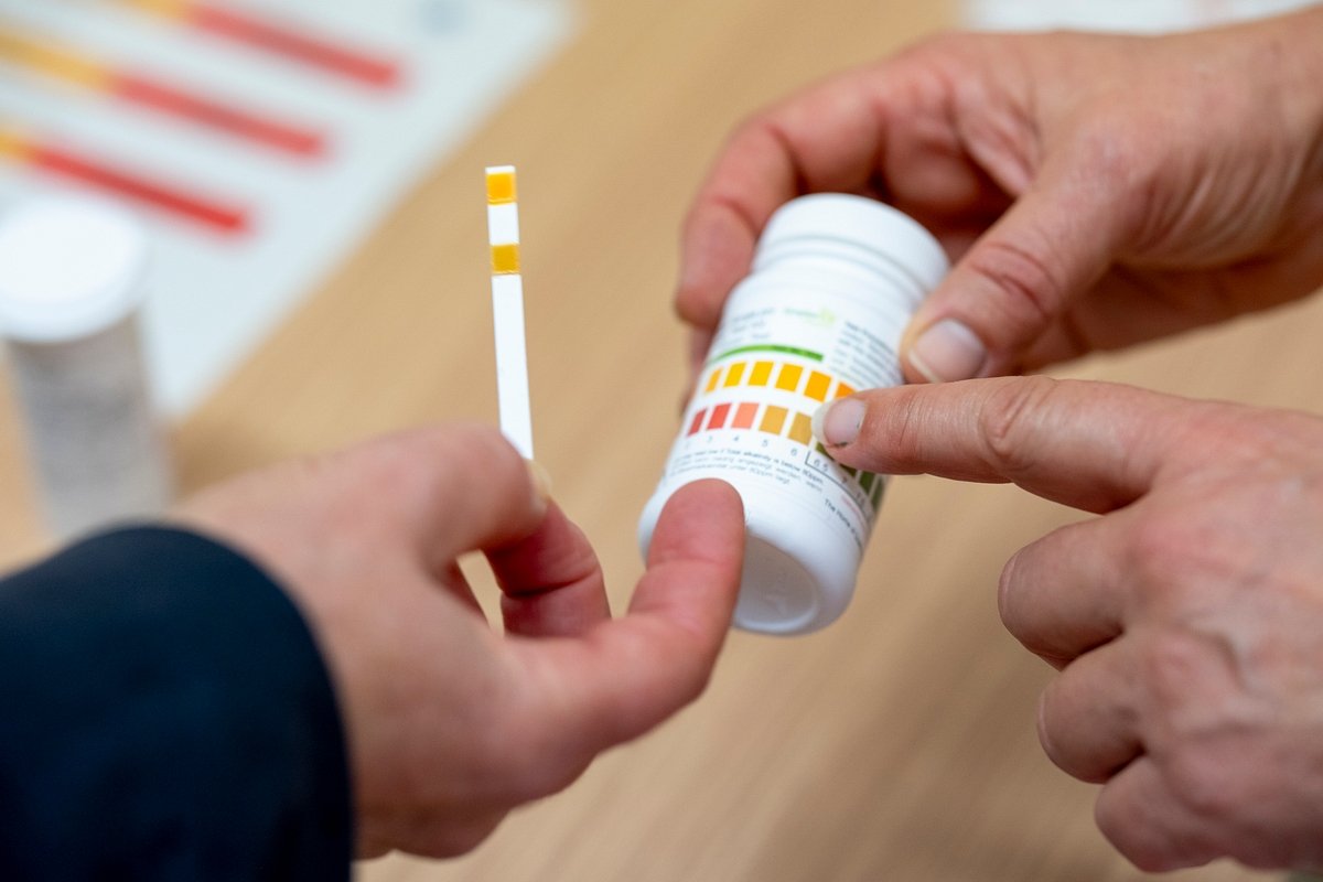 hands with testing kit mark .jpg