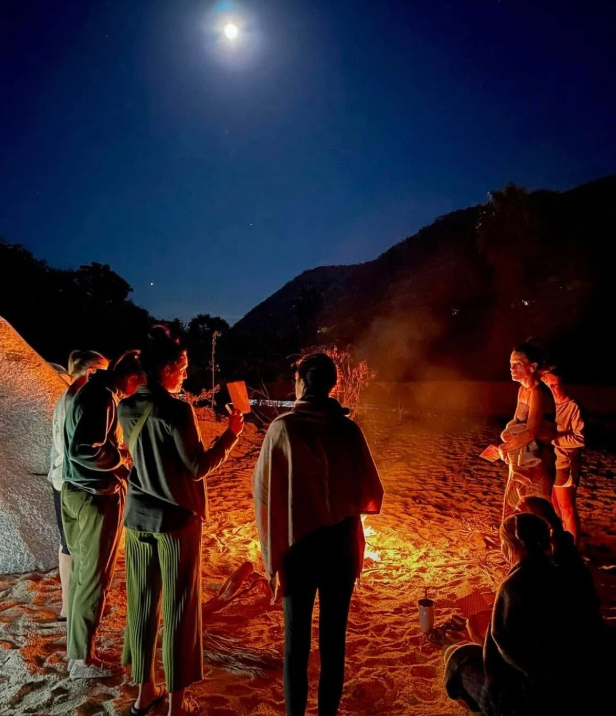 Women enjoying retreat campfire.