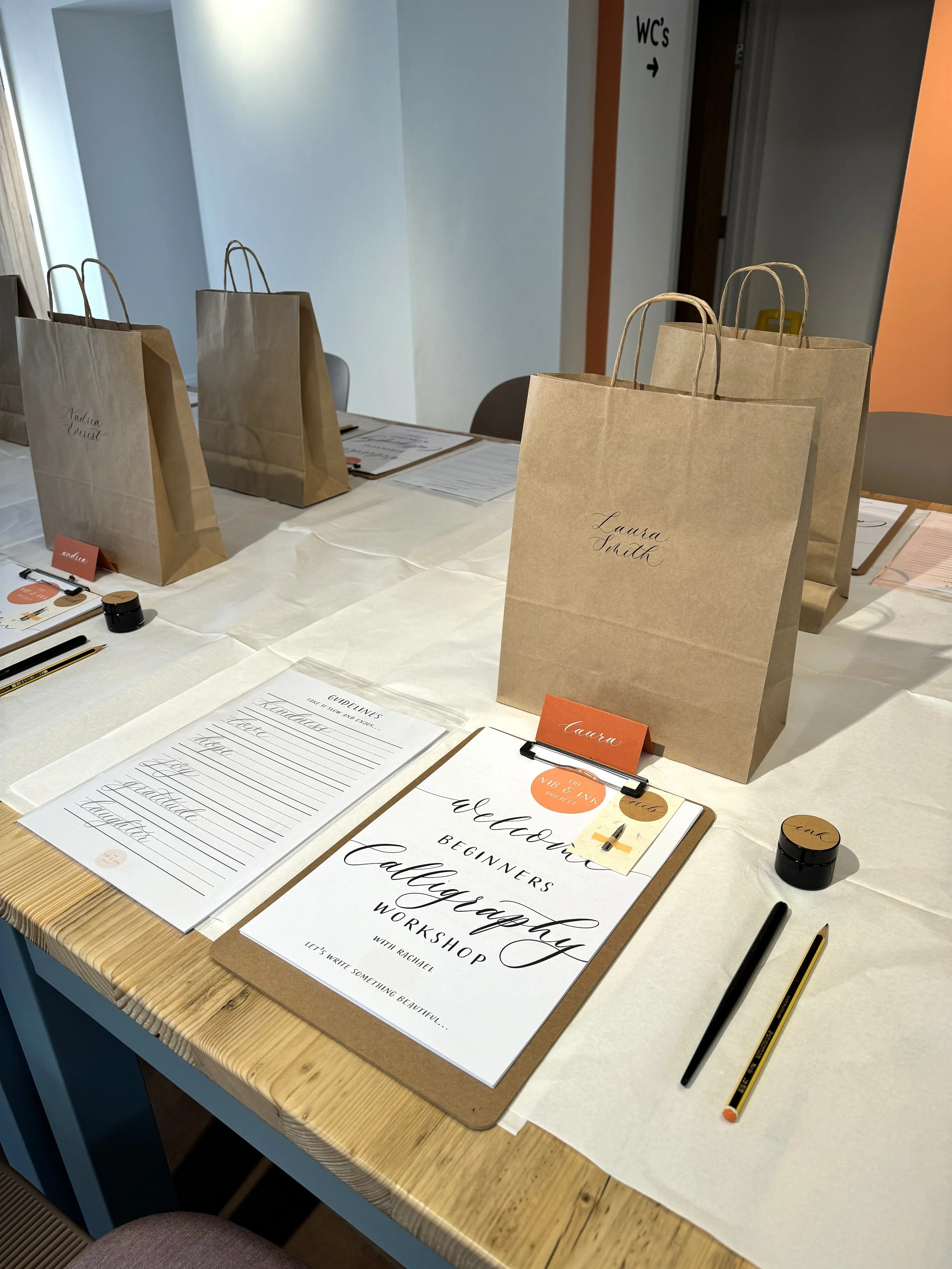 Image of workshop set-up, including calligraphy kit