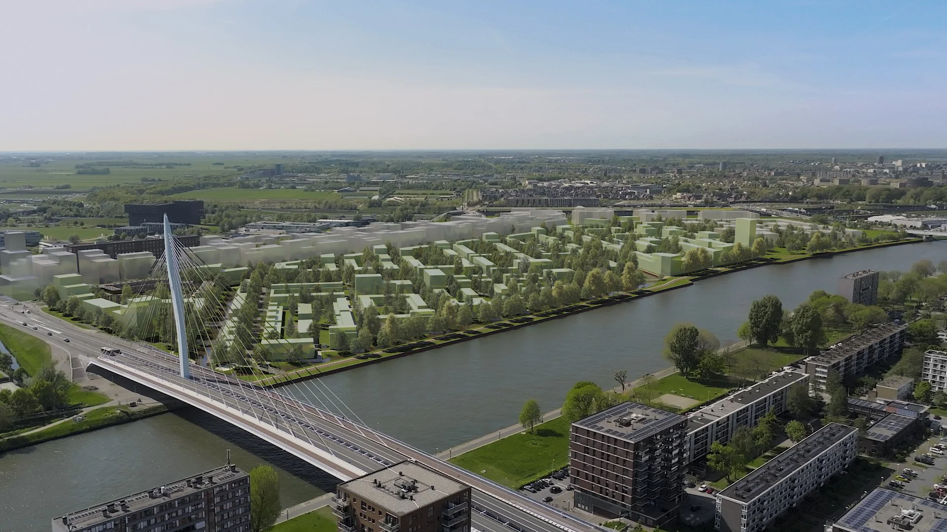 Luchtfoto van een moderne stad met een rivier en een brug met een boog en touwen, groene parken en recent gebouwde appartementen, met in de achtergrond een uitgestrekt landschap.