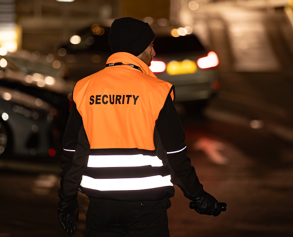 High visibility security guard carrying out patrol duties in Cardiff