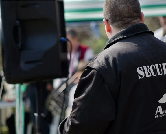 Event security guard monitoring crowd and access control in London