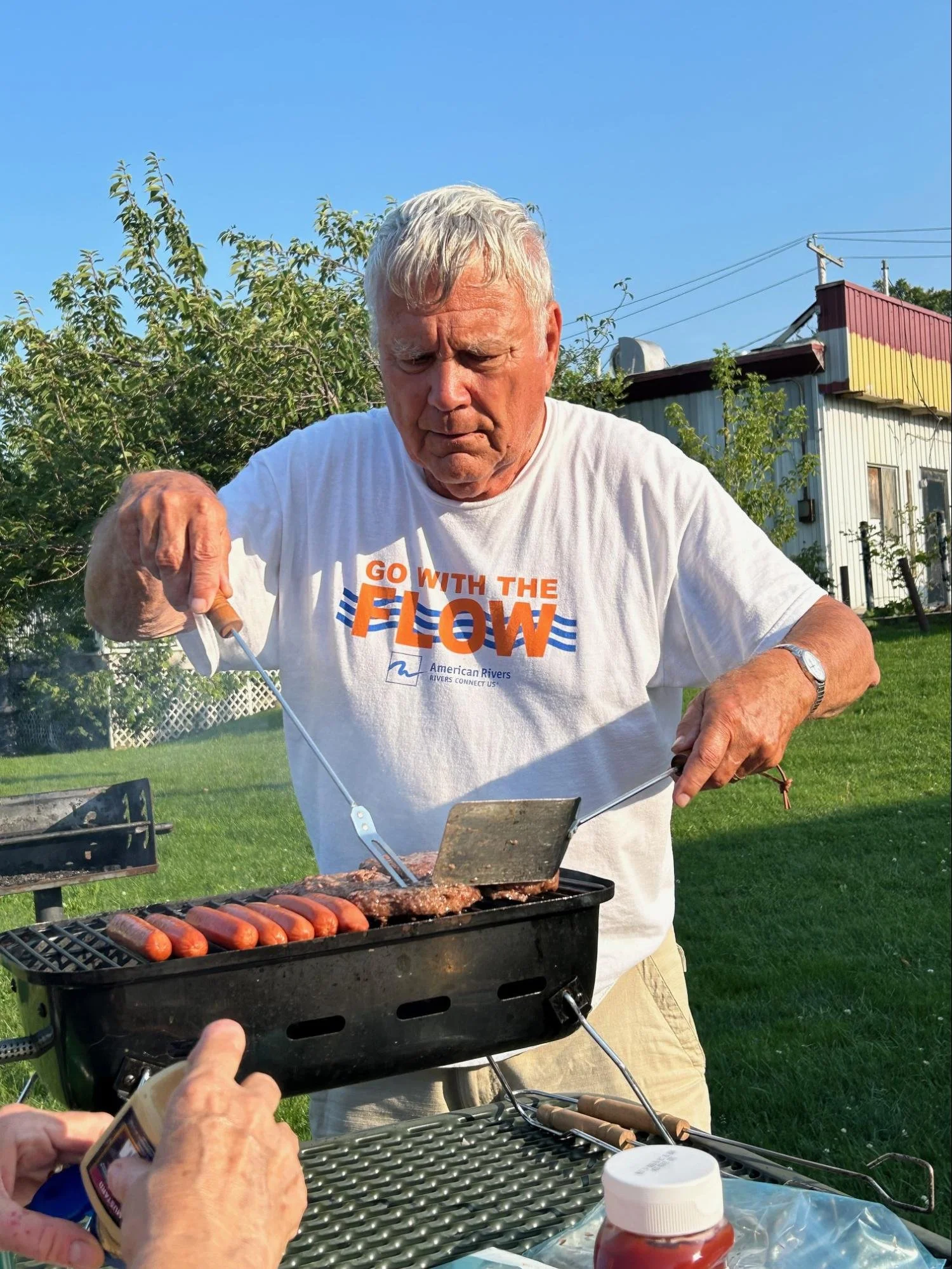 Hank grilling dogs &amp; burgers