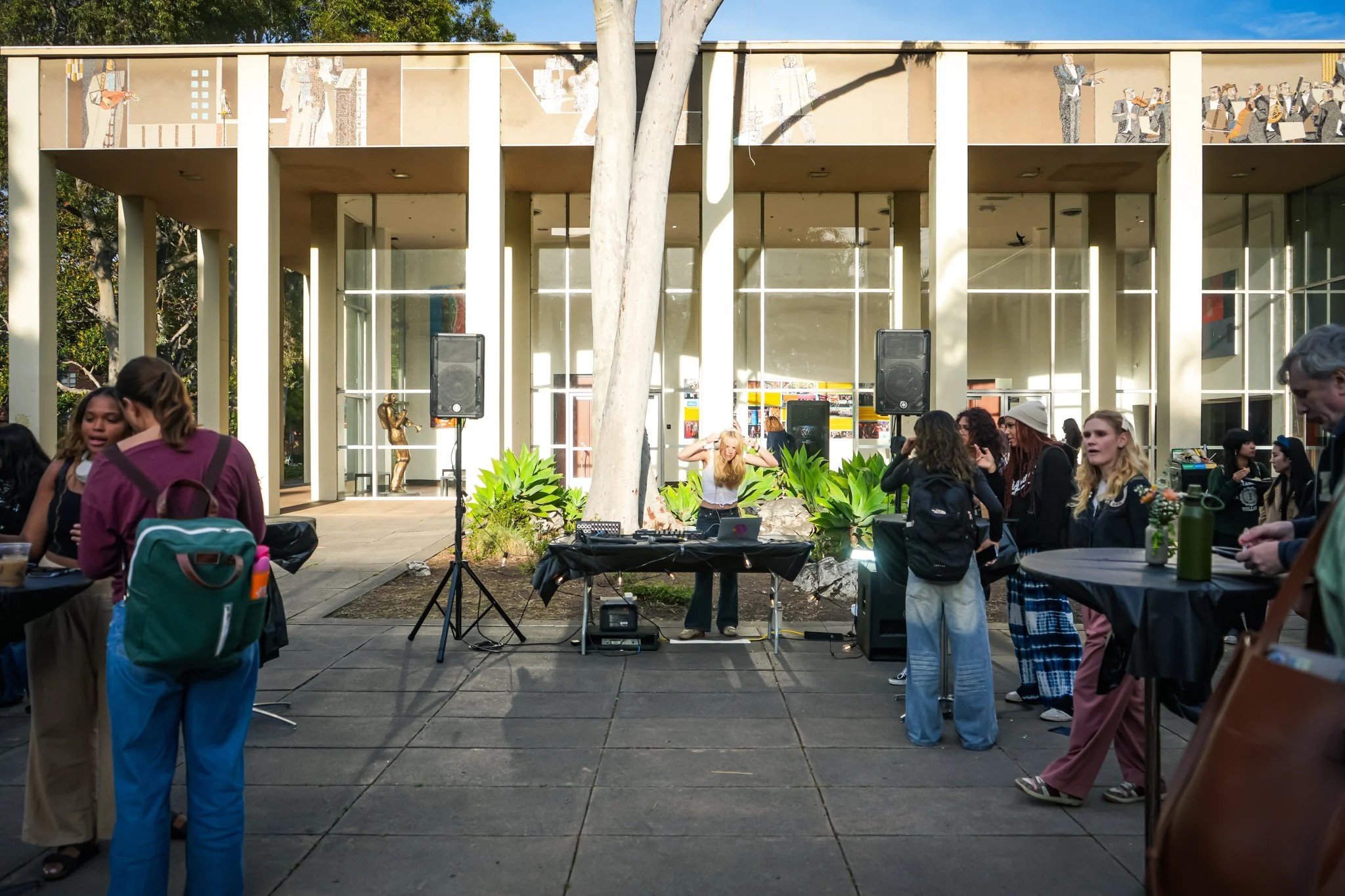 Professional PA speaker system and live sound rental setup for a corporate networking event in Sacramento with guests gathering outdoors.