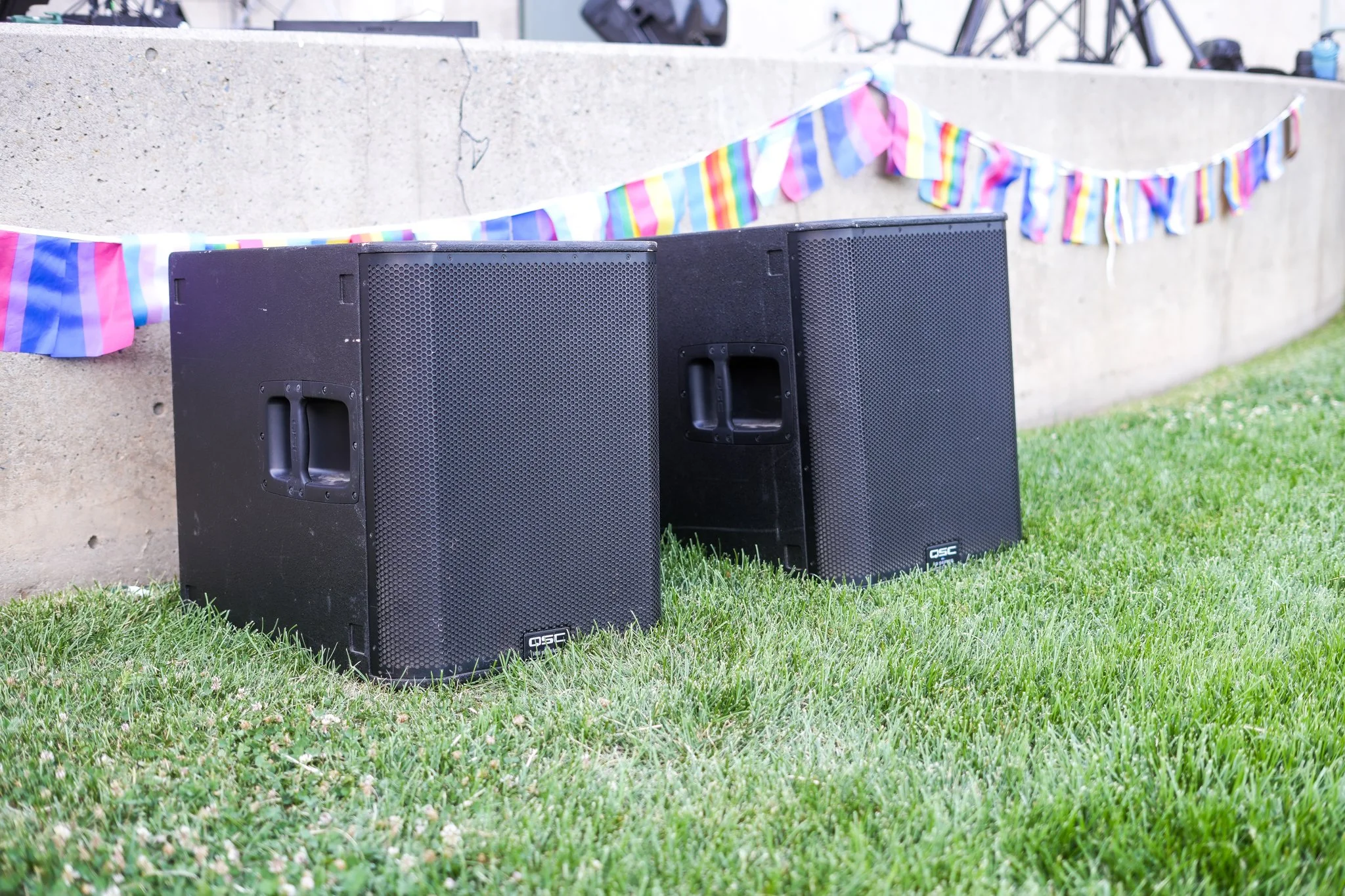 Professional PA subwoofers and live sound speakers set up for an outdoor event in Sacramento, providing powerful audio reinforcement for concerts and community festivals.