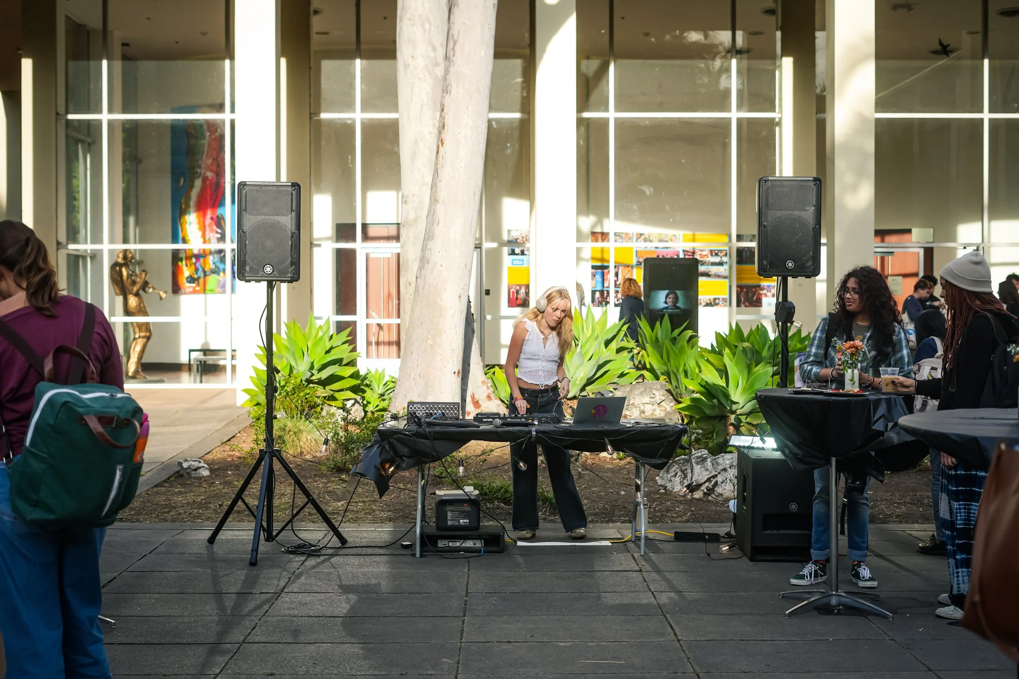 Professional DJ and PA speaker setup providing live sound rental and background music for a corporate networking event in Sacramento.
