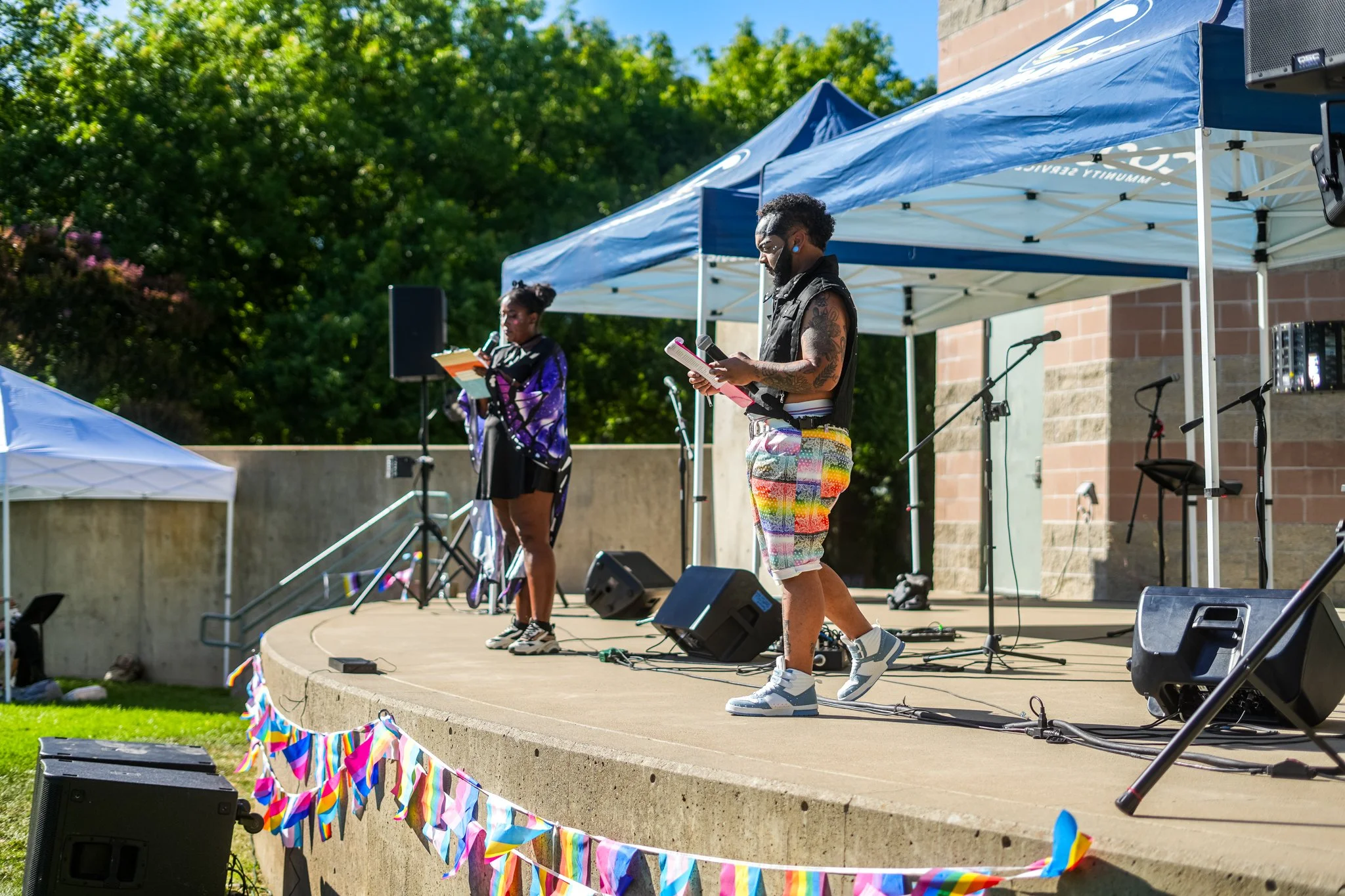 Professional live sound rental setup for an outdoor community event in Sacramento featuring PA speakers, stage monitors, microphones, and experienced audio engineers.