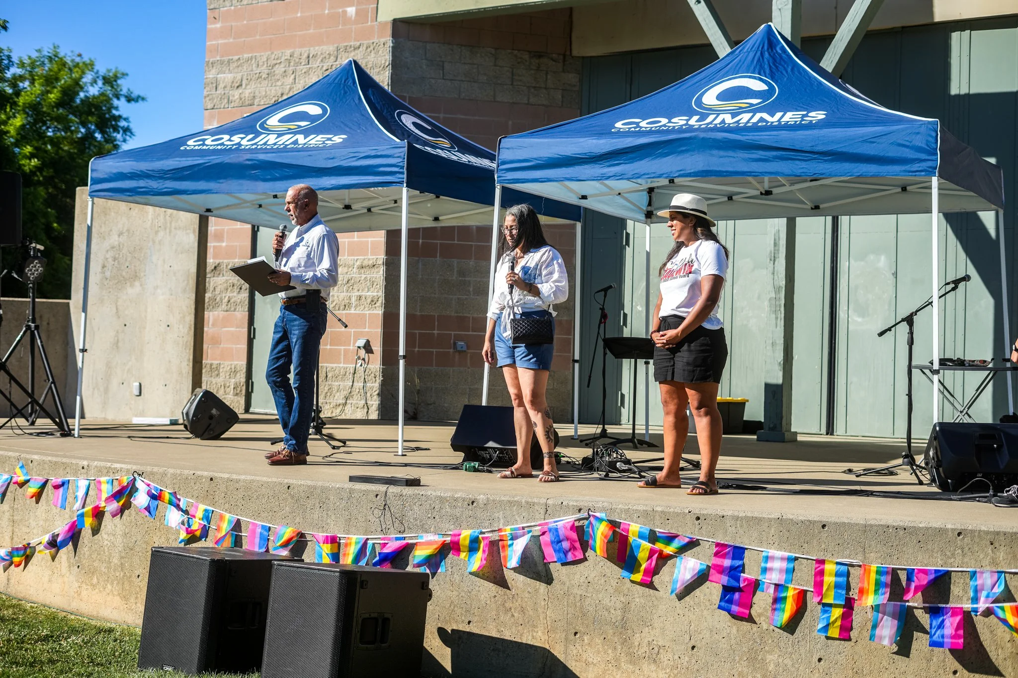 City officials speaking on stage with professional live sound rental, PA speakers, microphones, and event audio production in Sacramento.