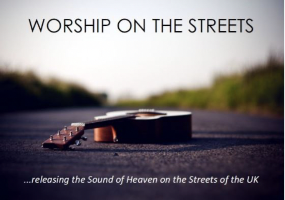 Worship on the streets ... releasing the sound of heaven on the streets of the UK. Picture of a guitar lying flat on a road.