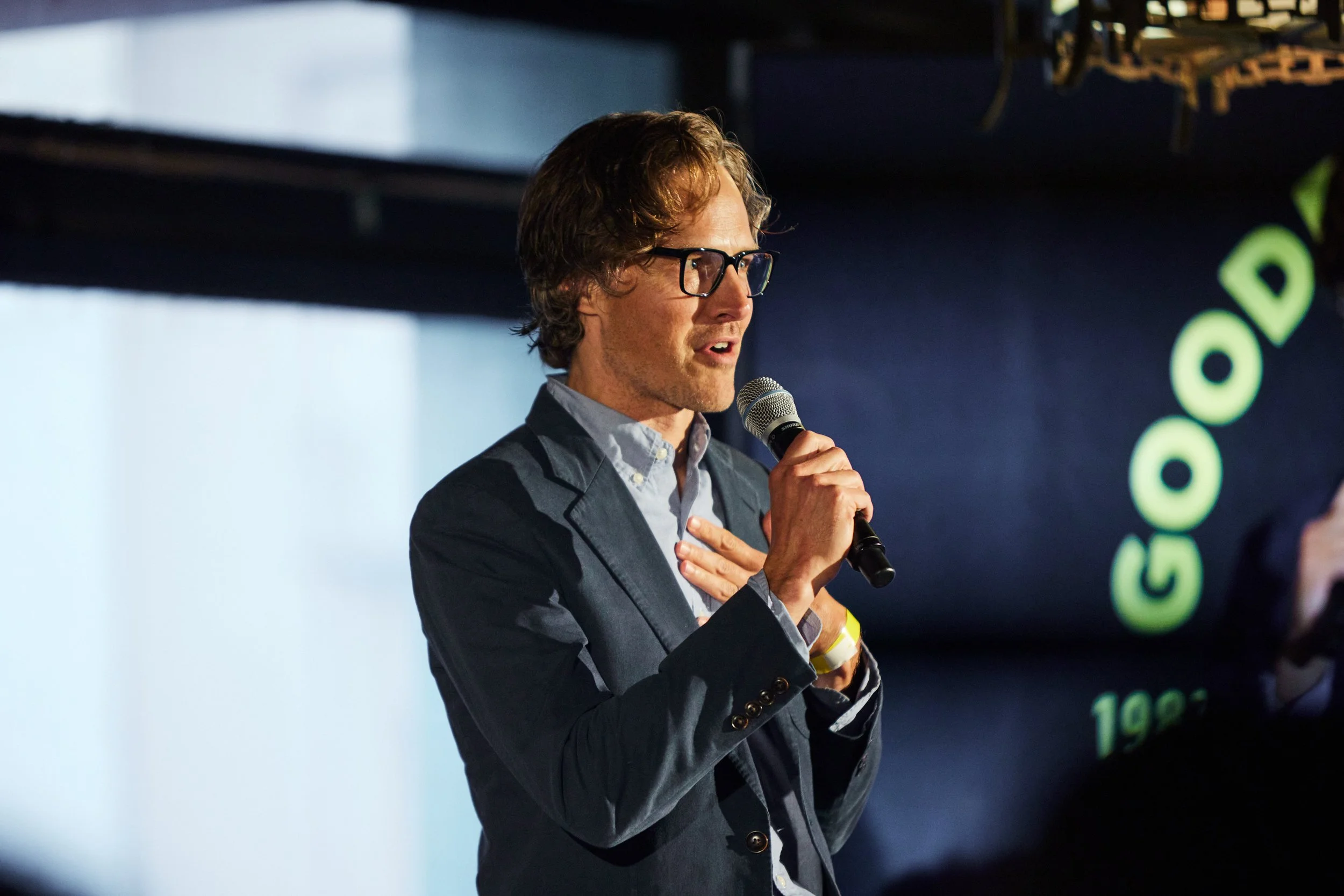 Ladd speaking at a marketing industry event.