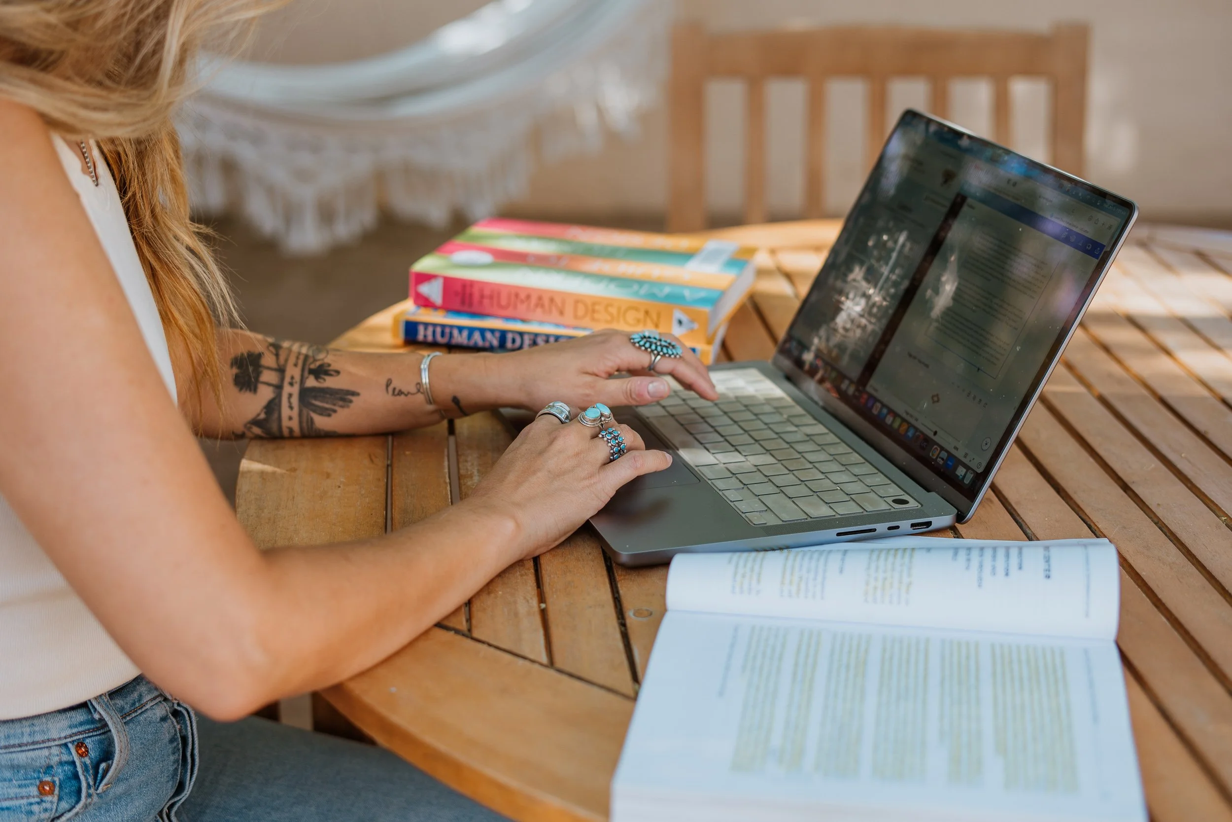 Woman complete Human Design Course on her laptop