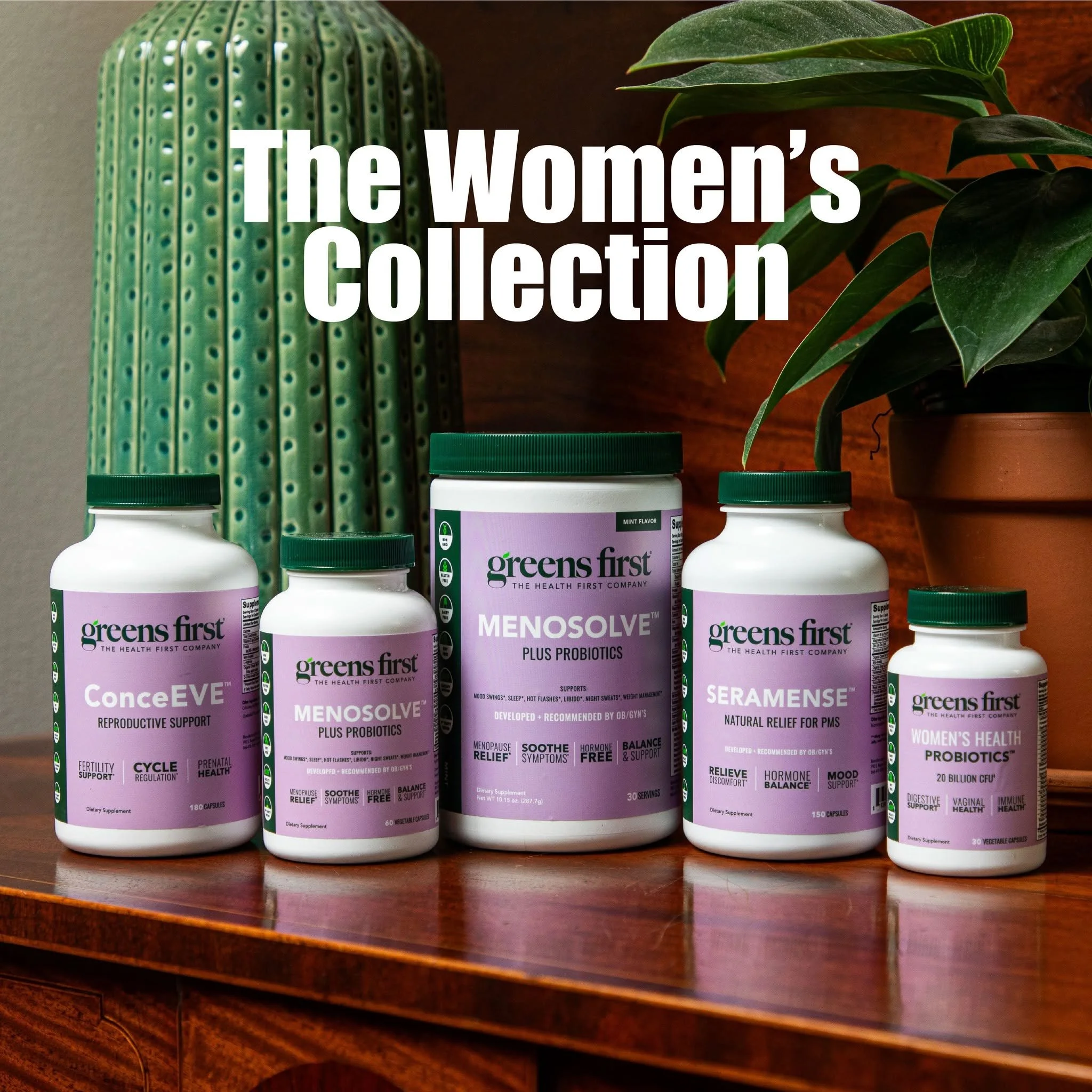 Greens First women's health supplement collection featuring Conceive, Menosolve, Seramense, and Women's Health Probiotics bottles on a wooden table with plants