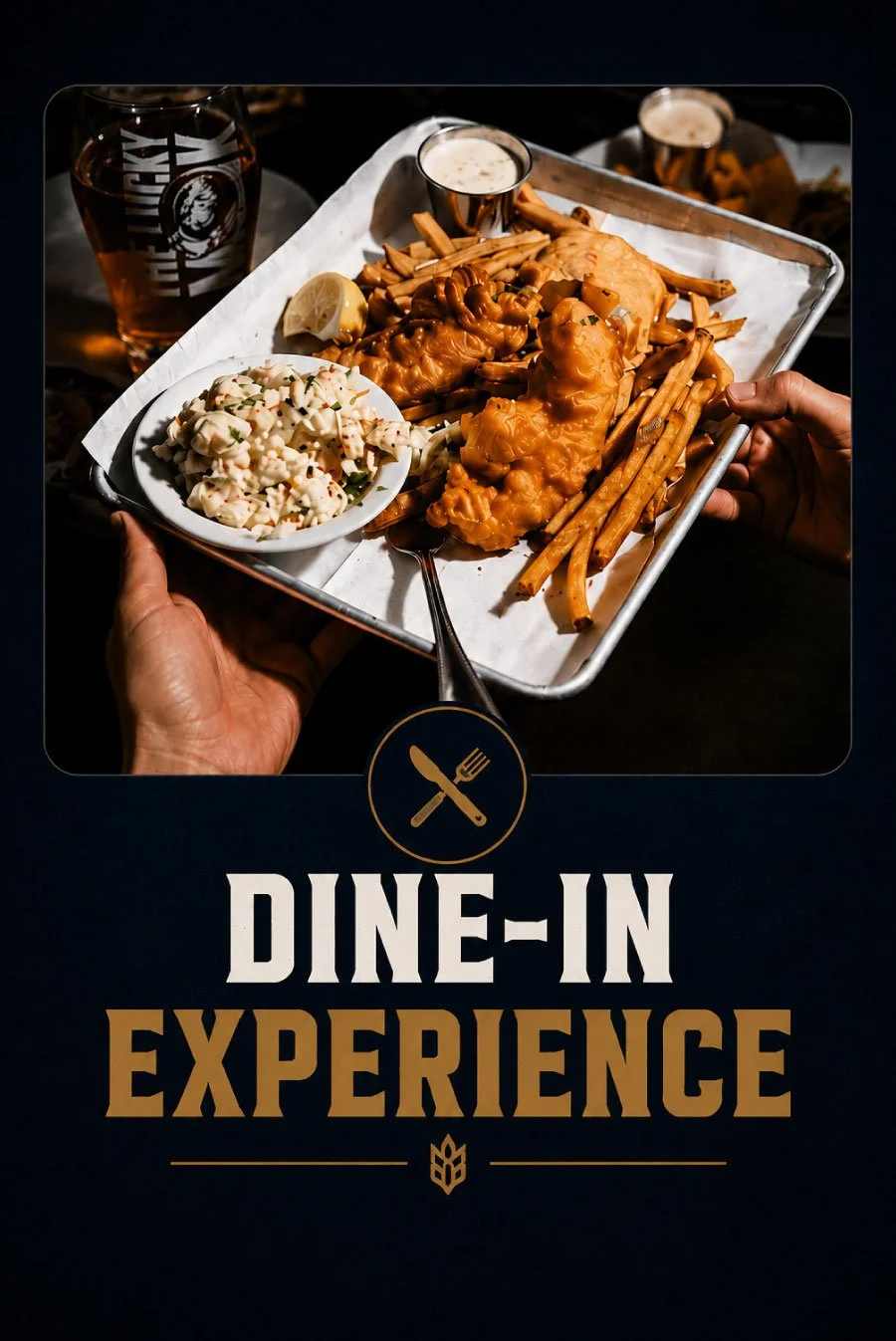 A tray of food with fried chicken, French fries, coleslaw, lemon wedge, and small drinks, held by a person.