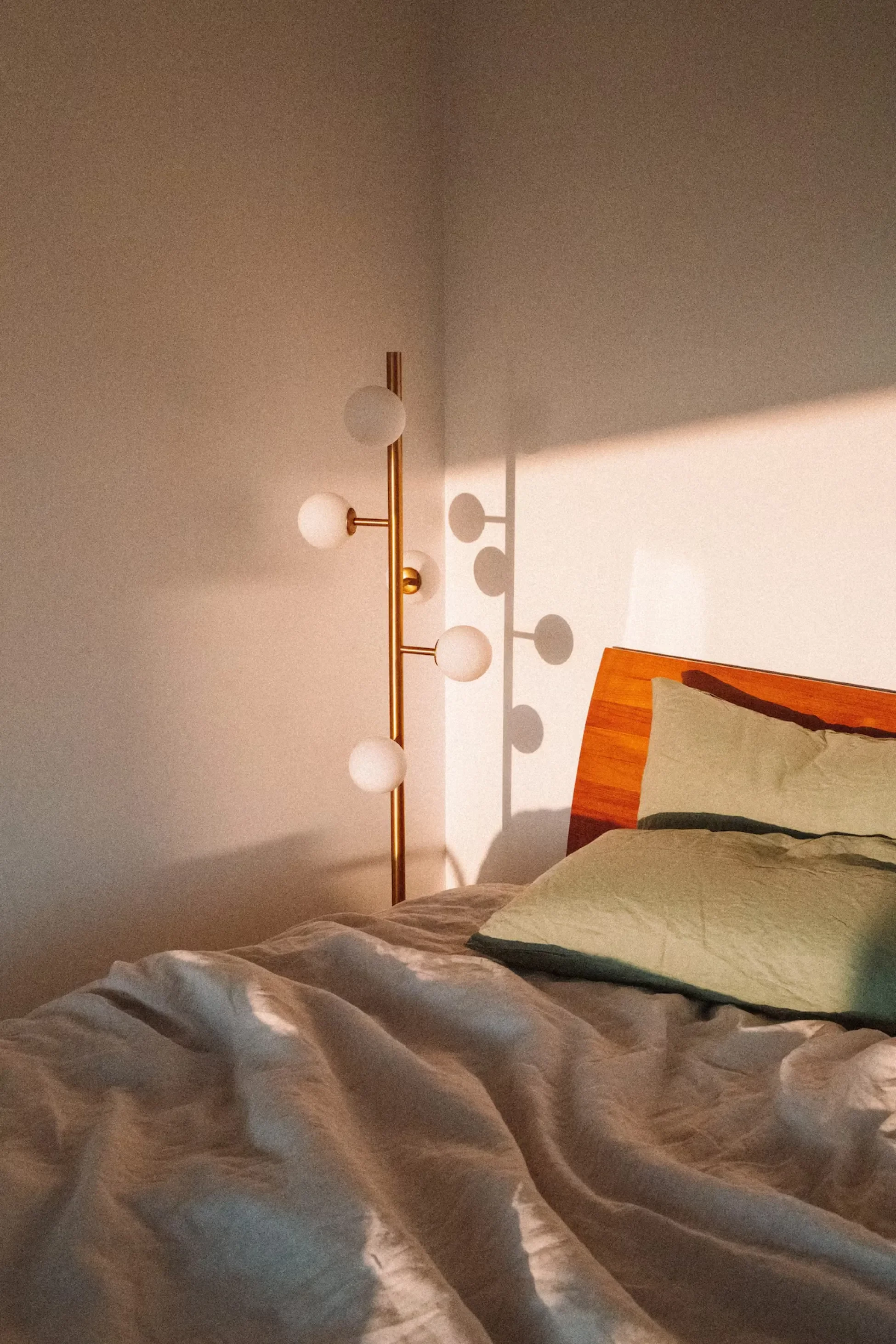 Sunlight streaming across a bedroom at Glass Holme in Hobart, Tasmania.