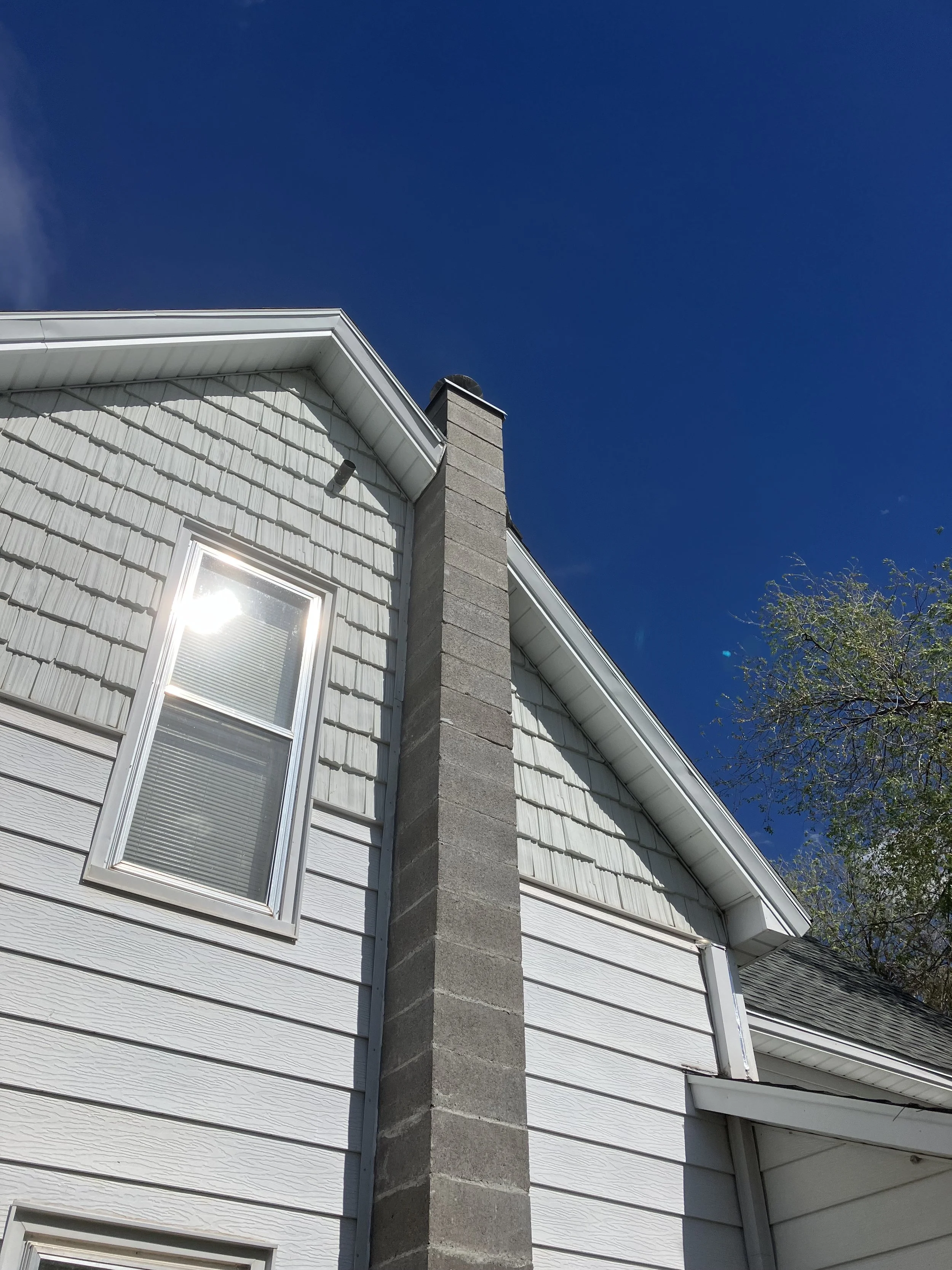 A complete rebuild of a block chimney.